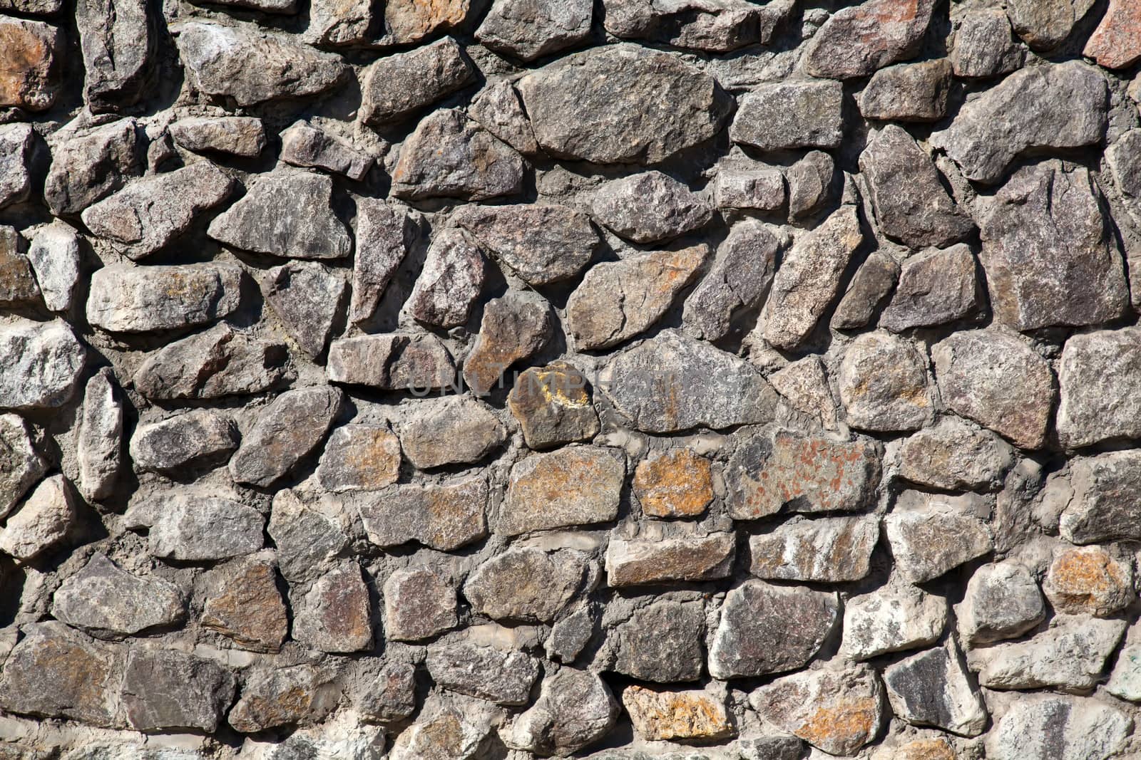 Old gray granite stone wall background