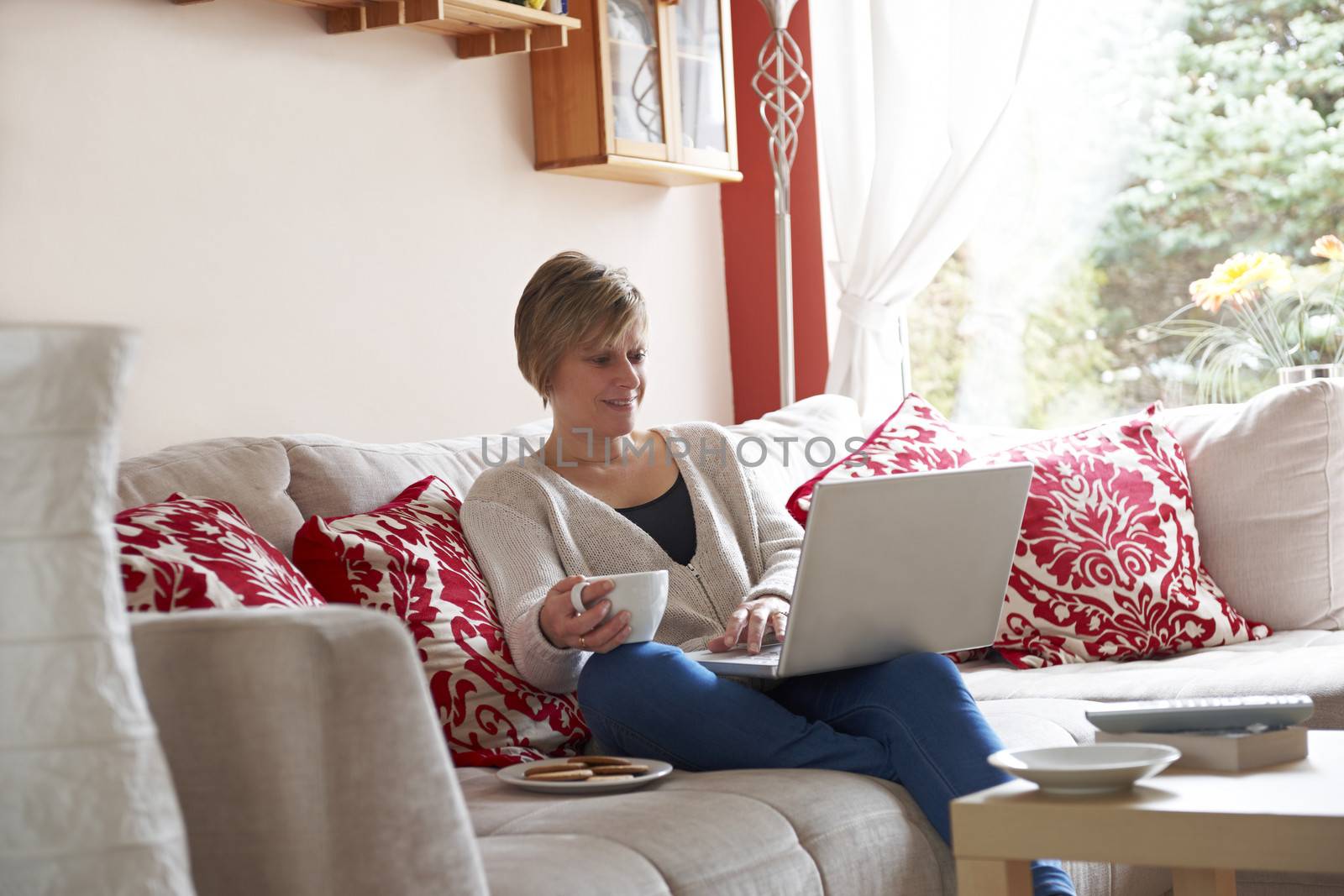 Mother on laptop computer by gemphotography