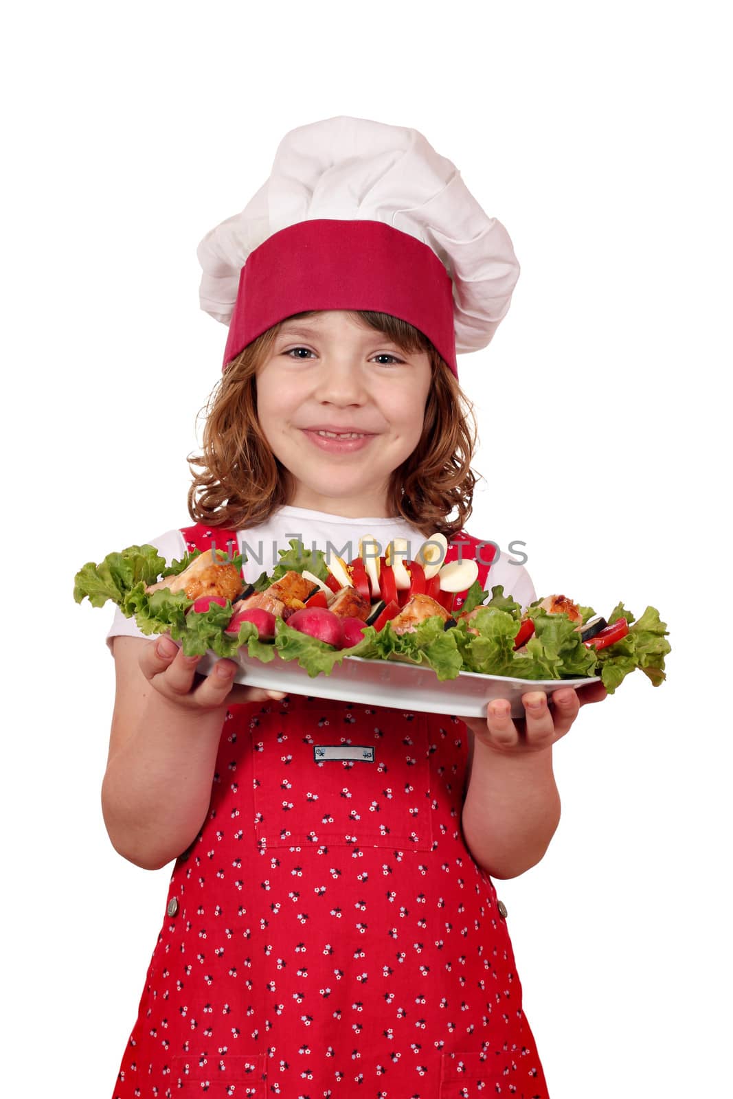 happy little girl cook with stuffed chicken meat and salad by goce