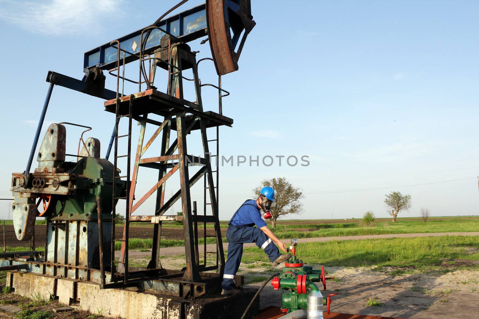 oil worker with gas mask check pipeline