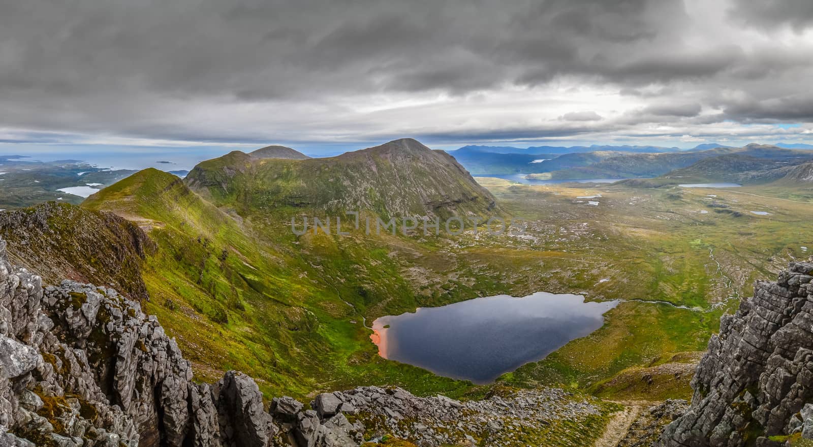 Panoramic view of Scottish highlands, mountains in Loch Assynt area, United Kingdom