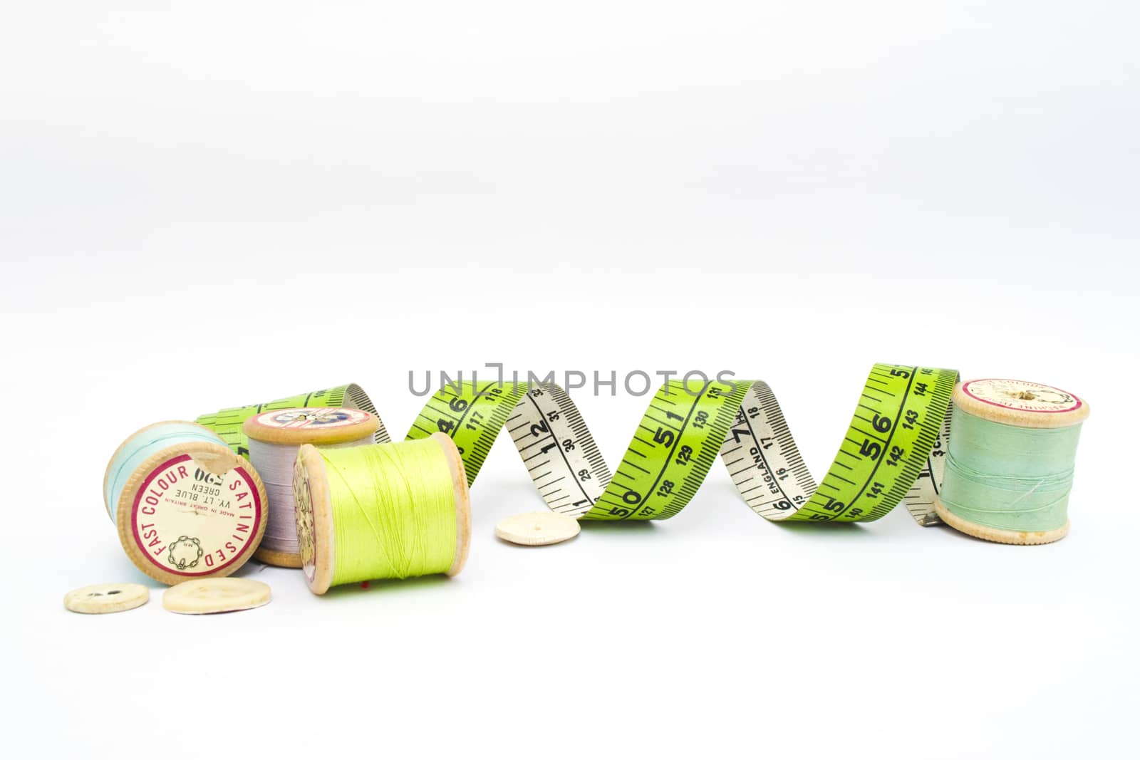 Various sewing kit equipment on a white background