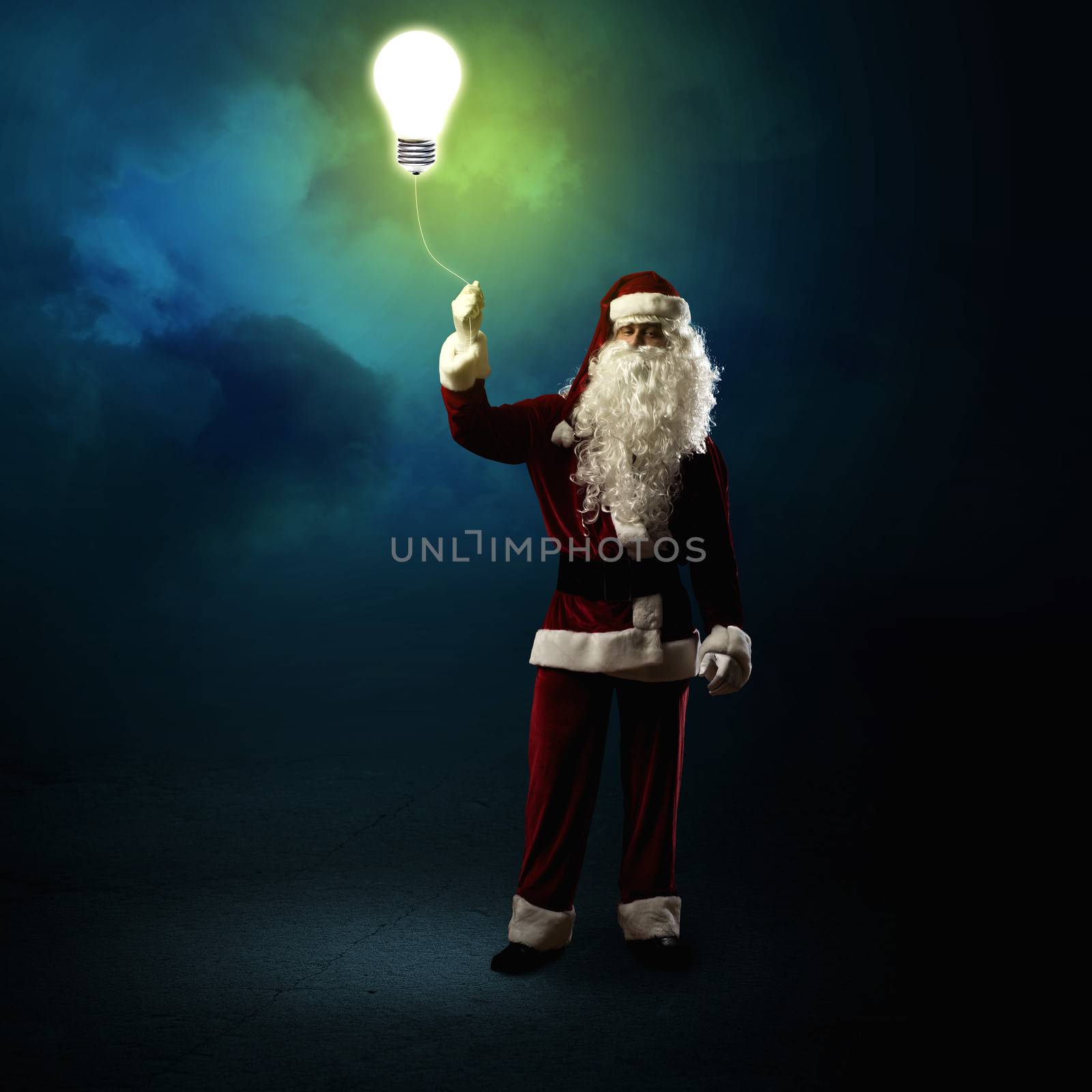 Santa Claus is holding a shining lamp by adam121