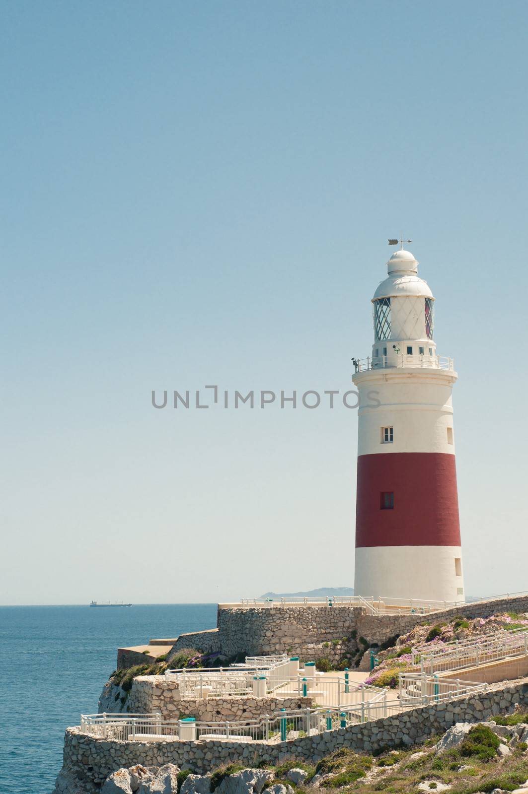 Lighthouse in Gibraltar, blue sky and sea