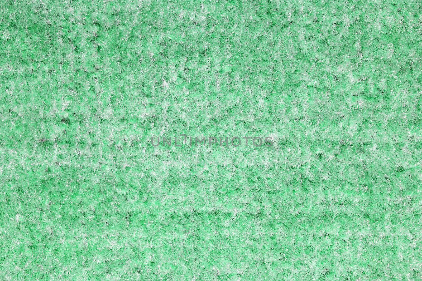 Background of green carpet or foot scraper