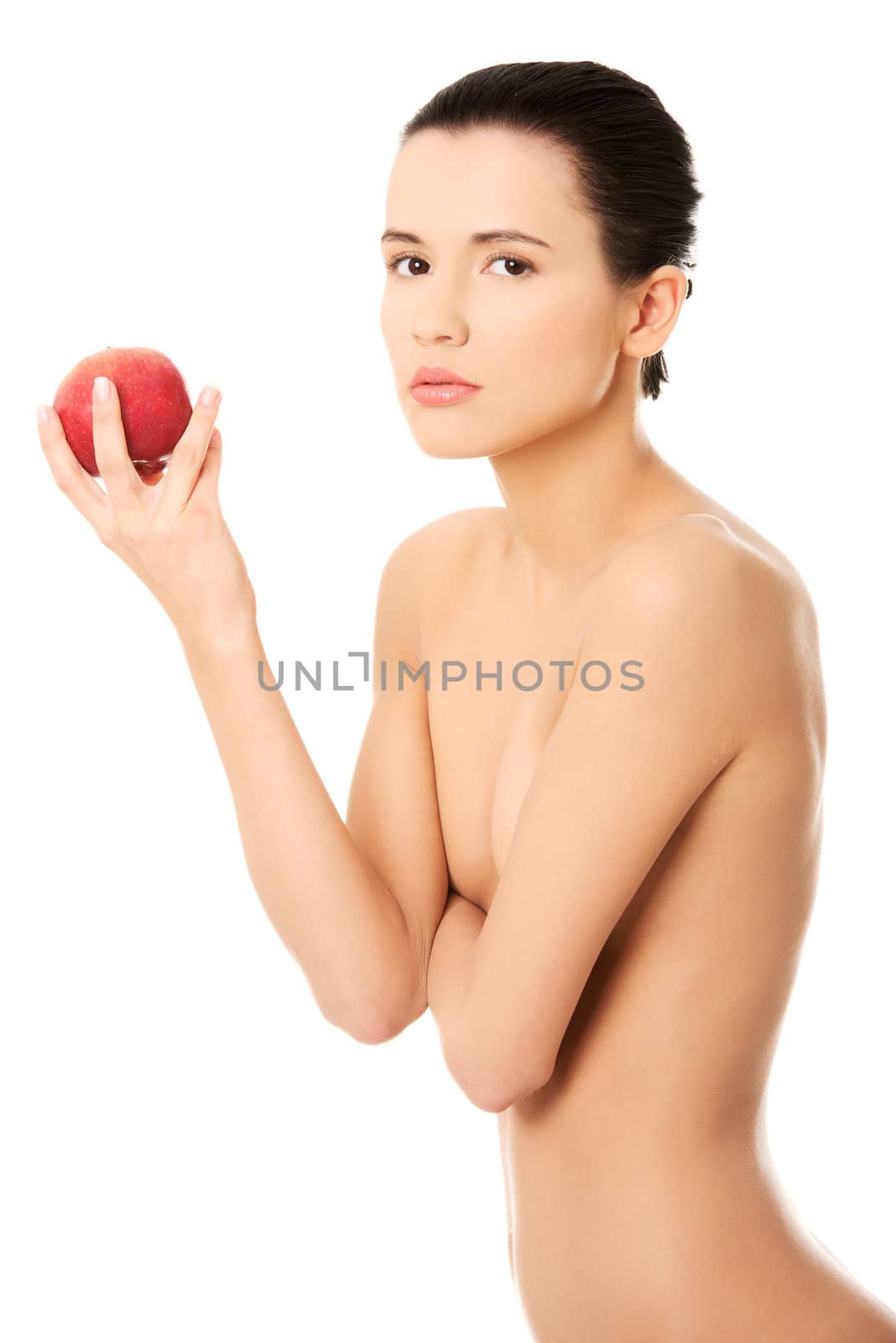 Beautiful woman with clean fresh healthy skin holding red apple. Isolated on white