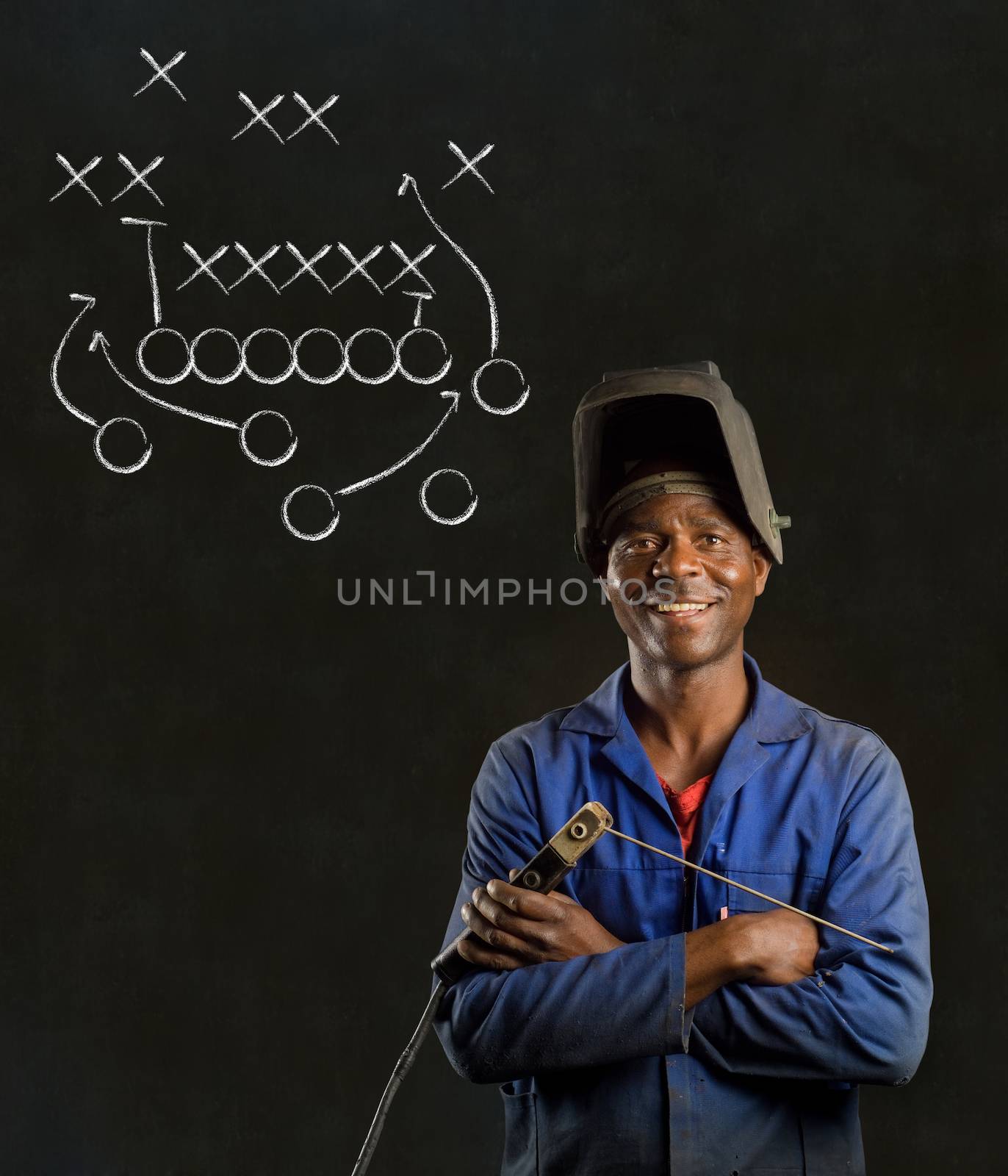 African American black man industrial worker with chalk game plan on a blackboard background