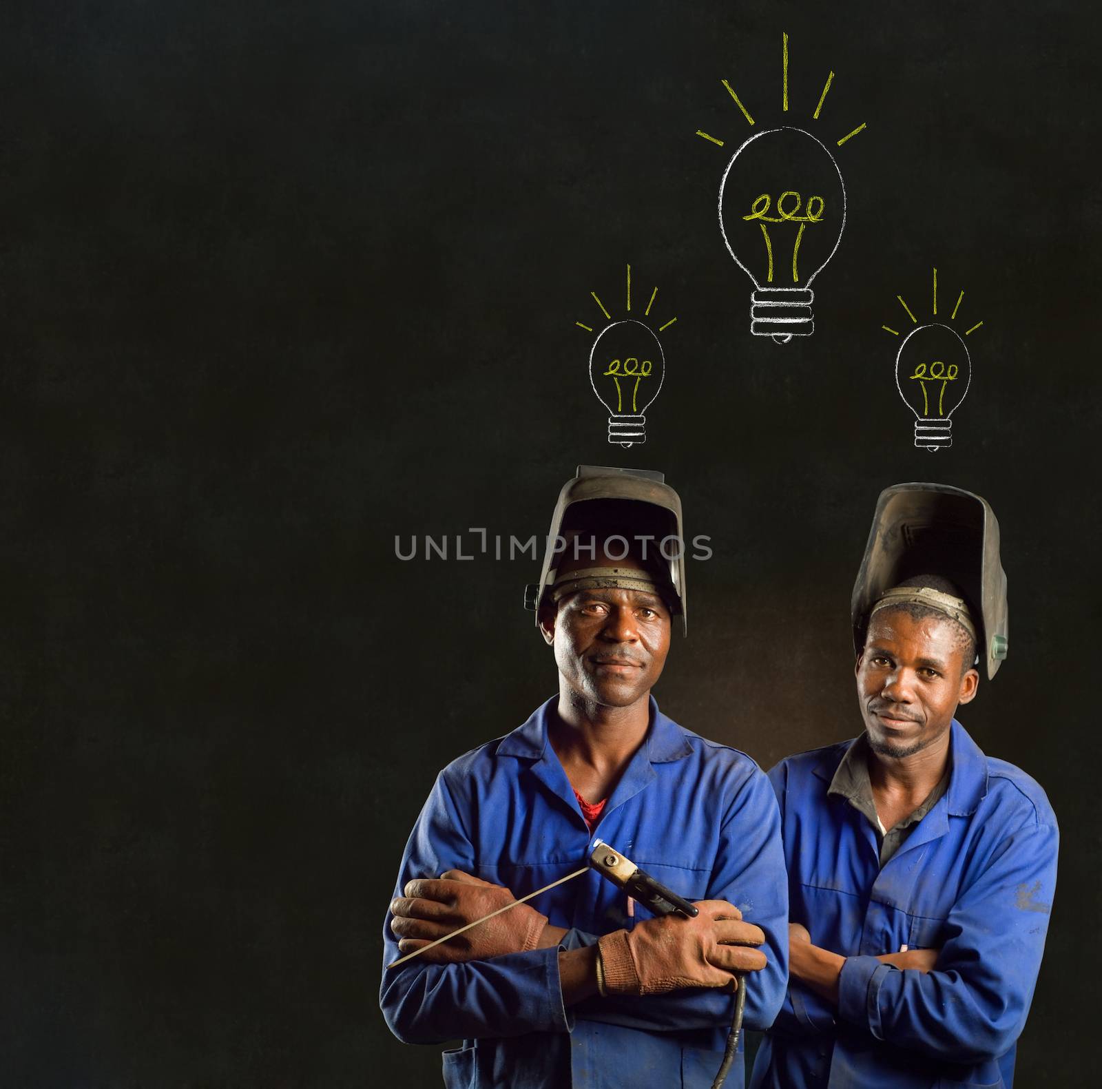 African American black man industrial worker with chalk light bulb on a blackboard background