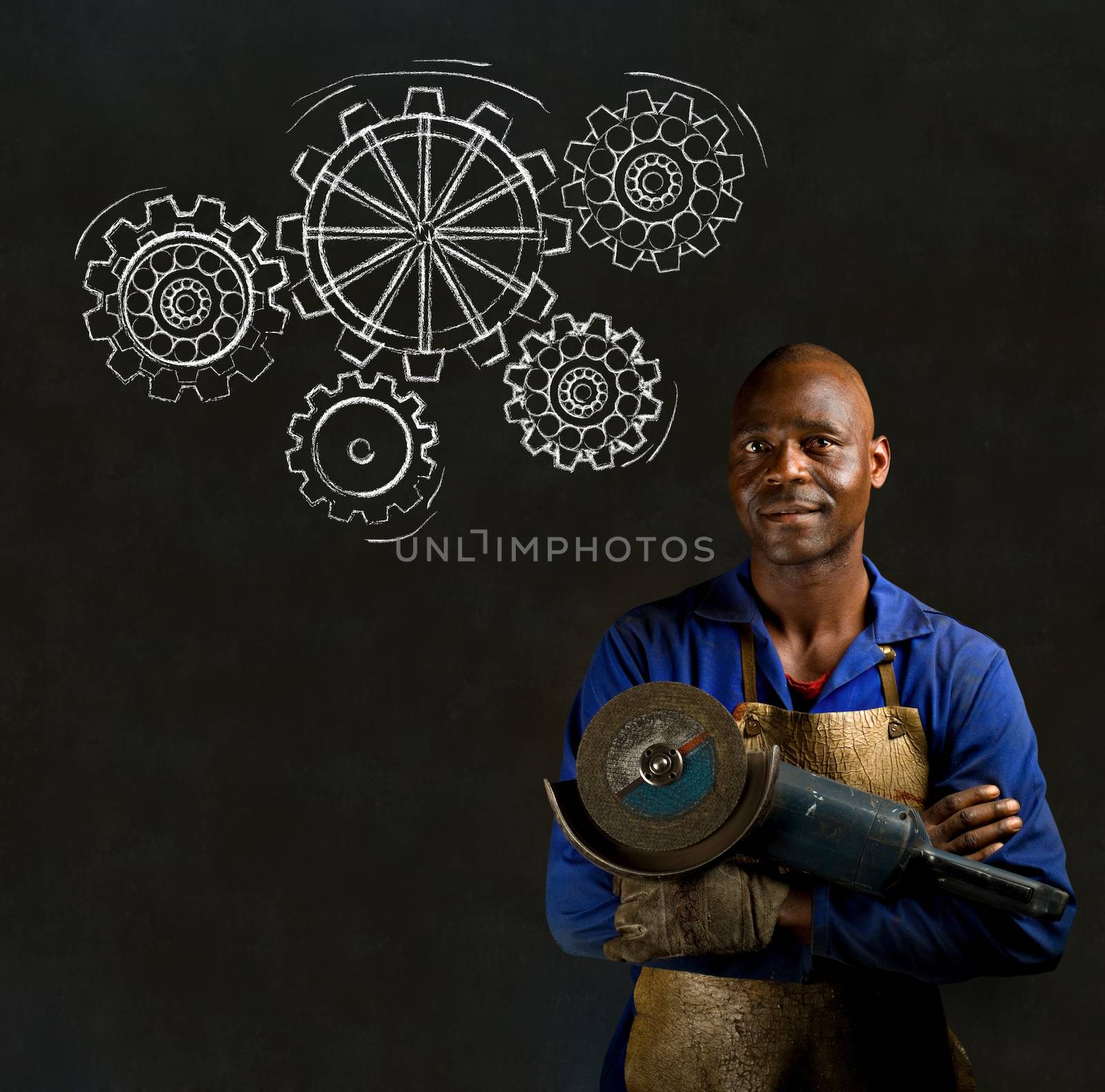 African American black man industrial worker with chalk gears on a blackboard background