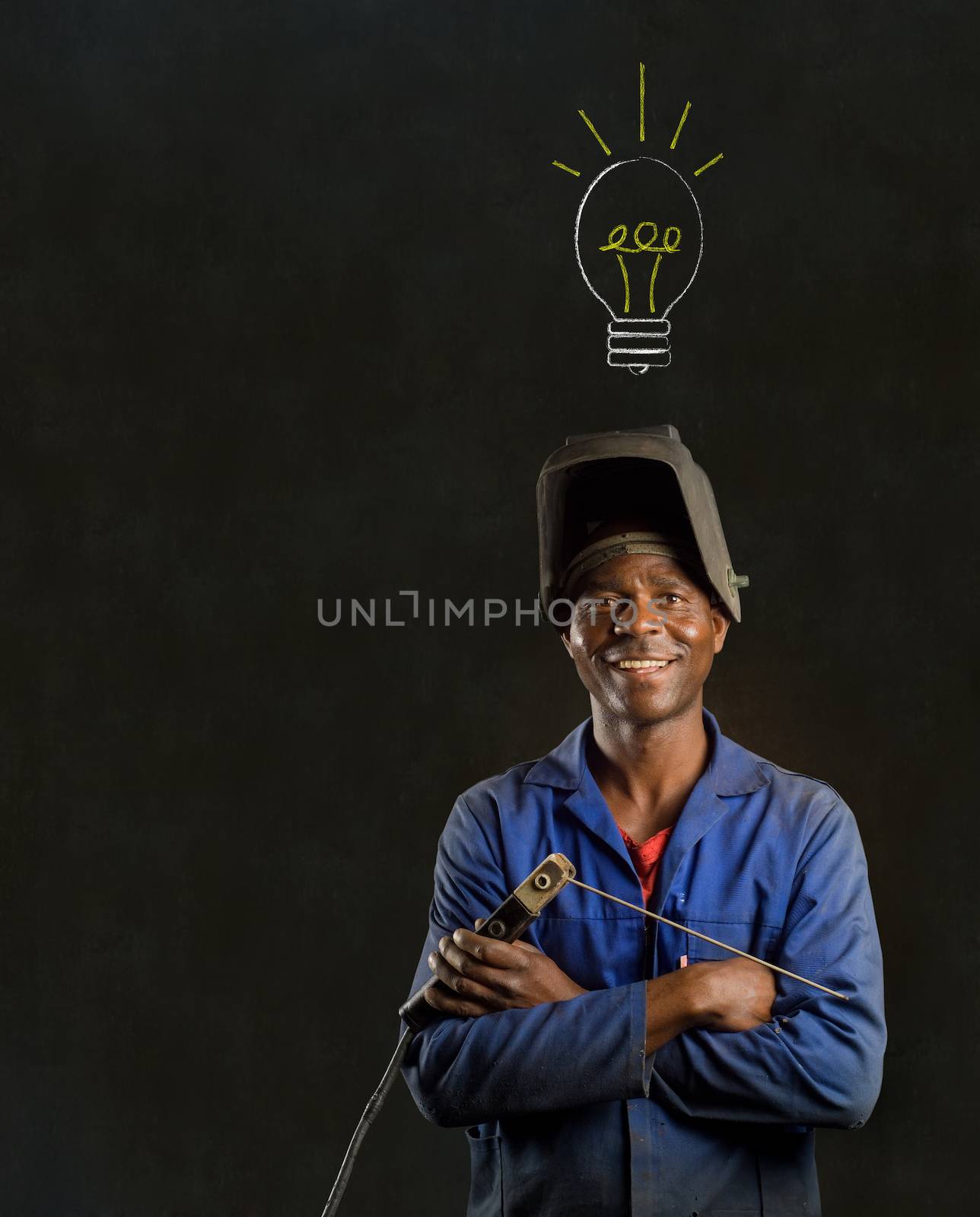 African American black man industrial worker with chalk light bulb on a blackboard background