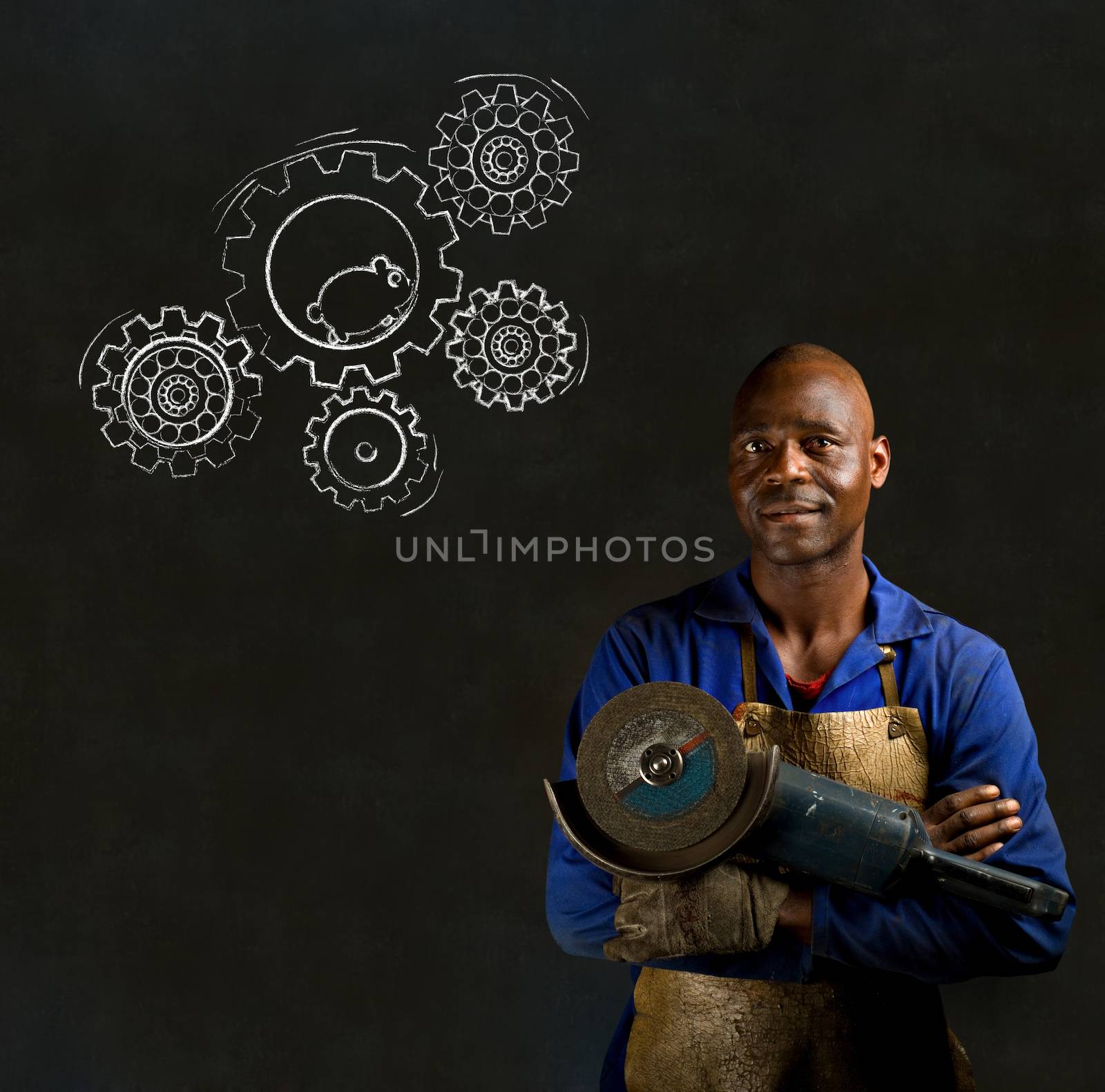 African American black man industrial worker with chalk hamster gears on a blackboard background