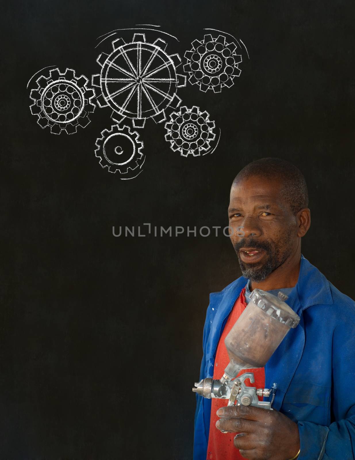 African black man industrial worker with chalk gears blackboard by alistaircotton