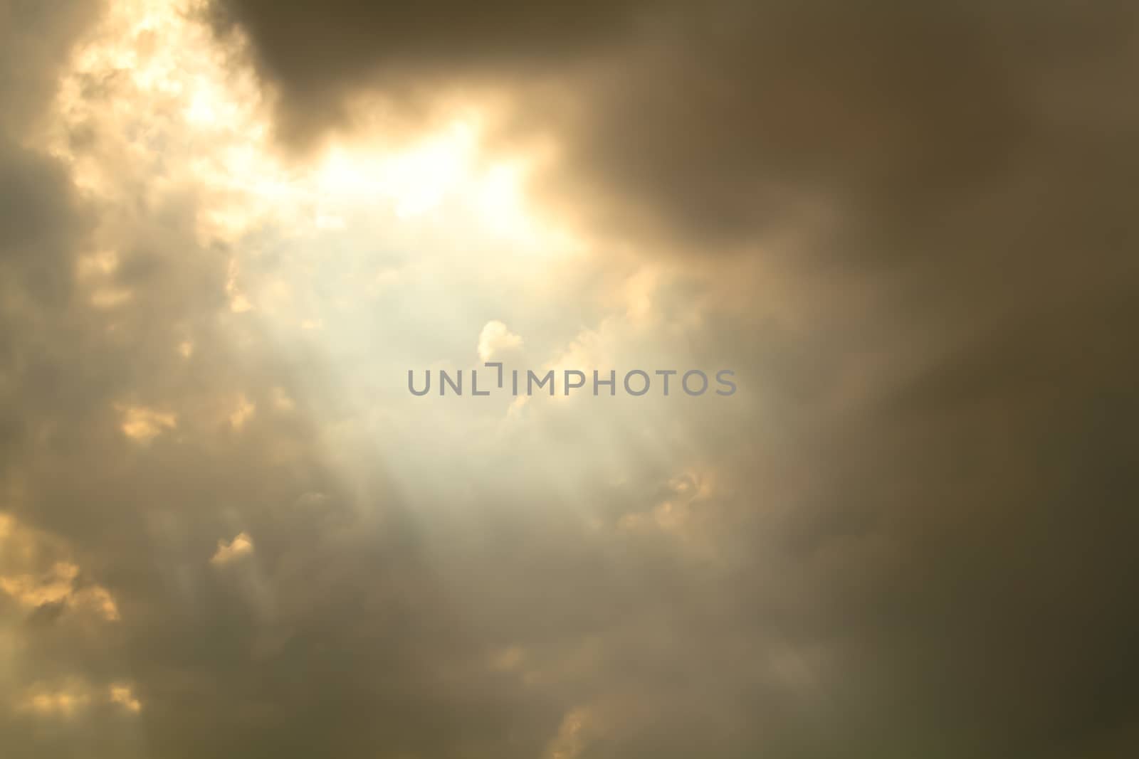 View of clouds in sky with rays of light