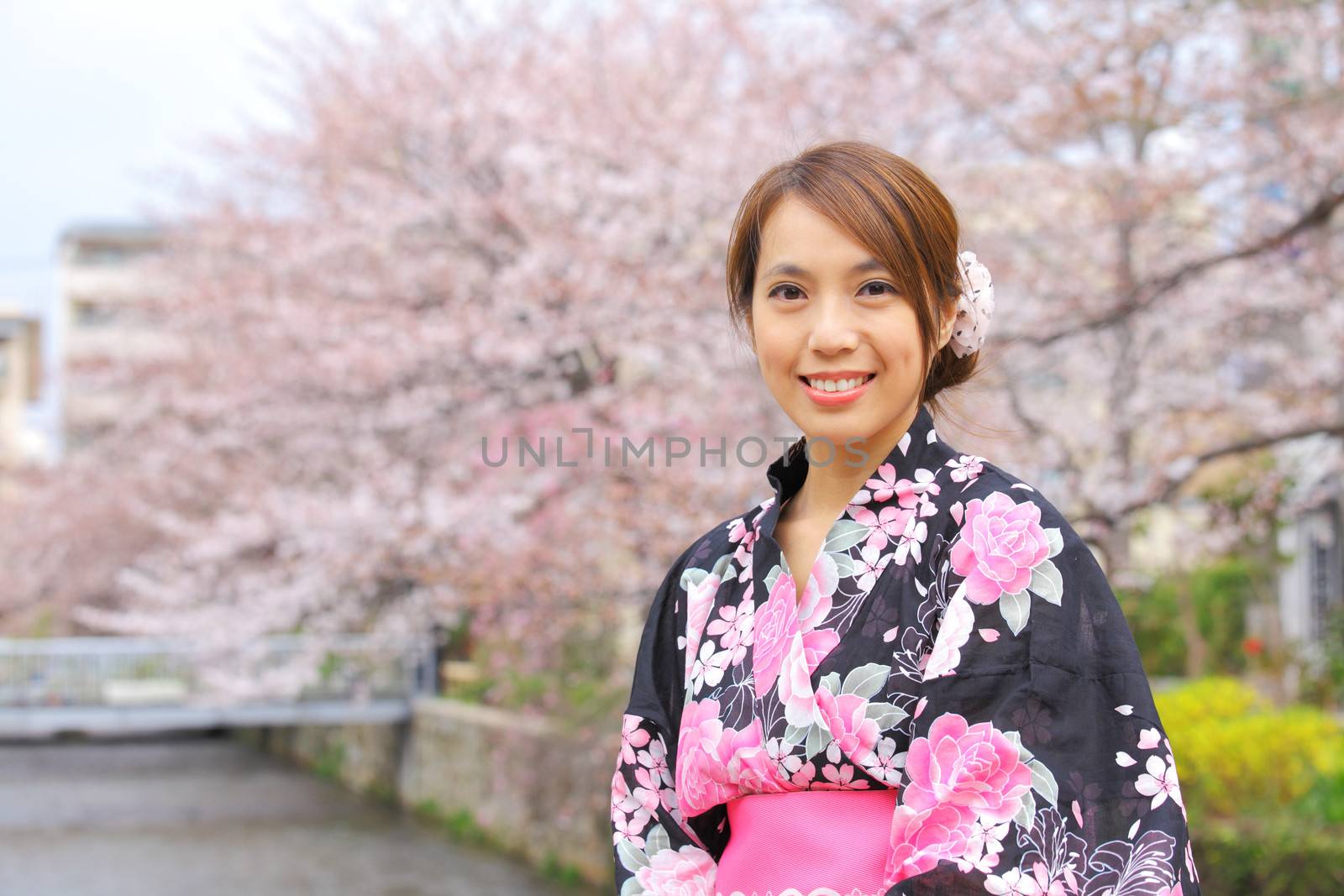 Japanese woman wearing kimono with cherry blossom by leungchopan