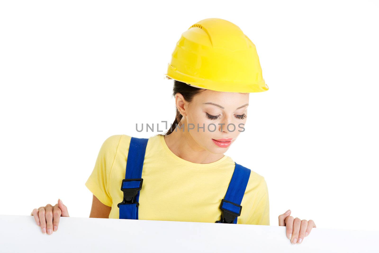 Female construction worker with blank board by BDS
