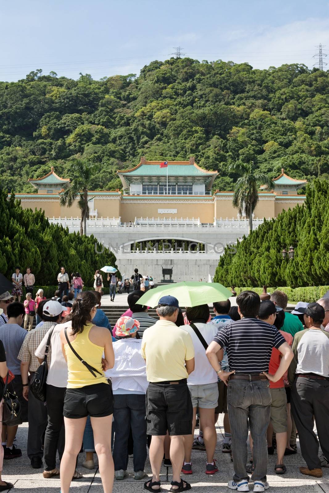 TAIPEI, TAIWAN - SEPTEMBER 4 : Many tourist people stand at the square in front of Taipei's National Palace Museum on September 4, 2013 in Taipei, Taiwan, Asia.