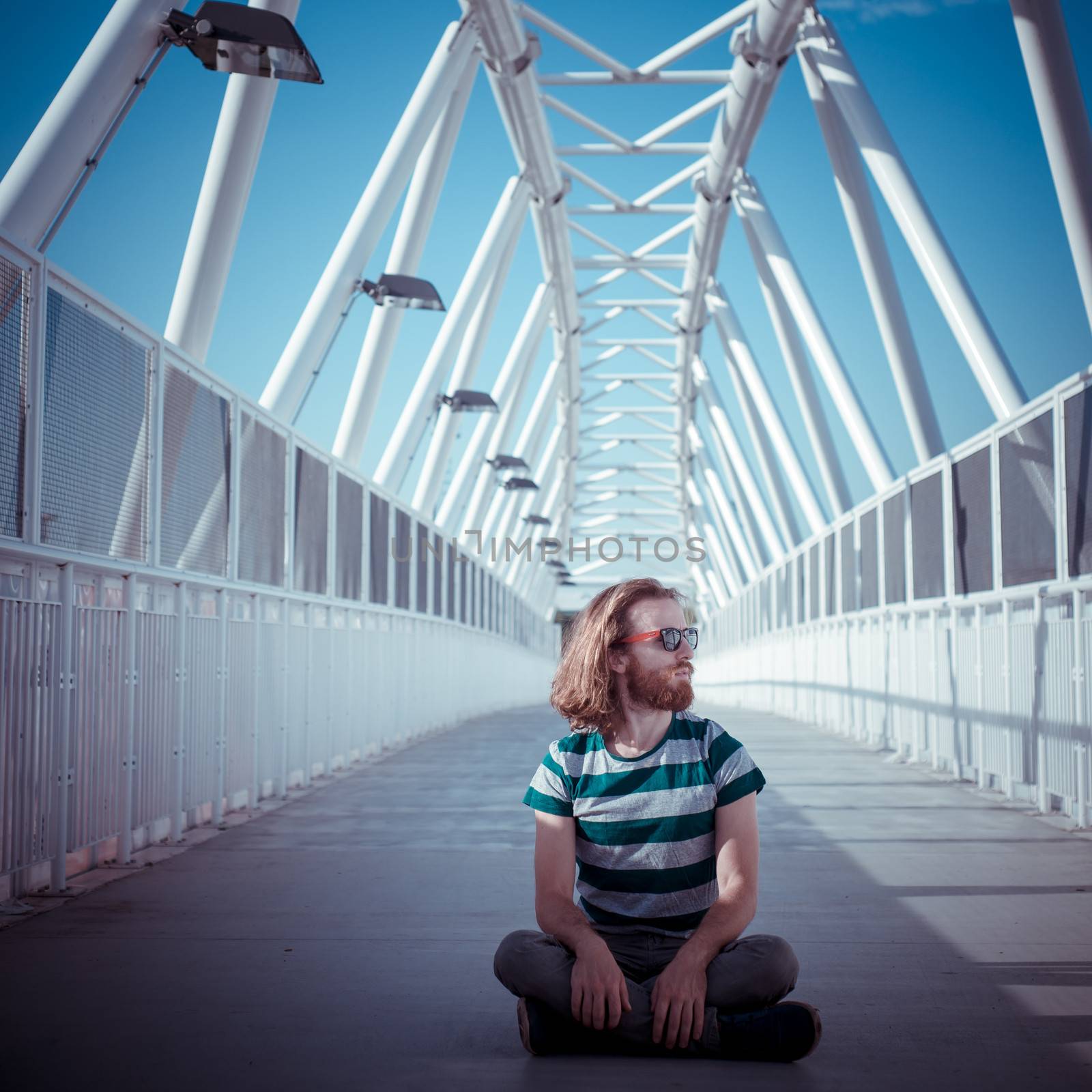 stylish hipster model with long red hair and beard yoga by peus
