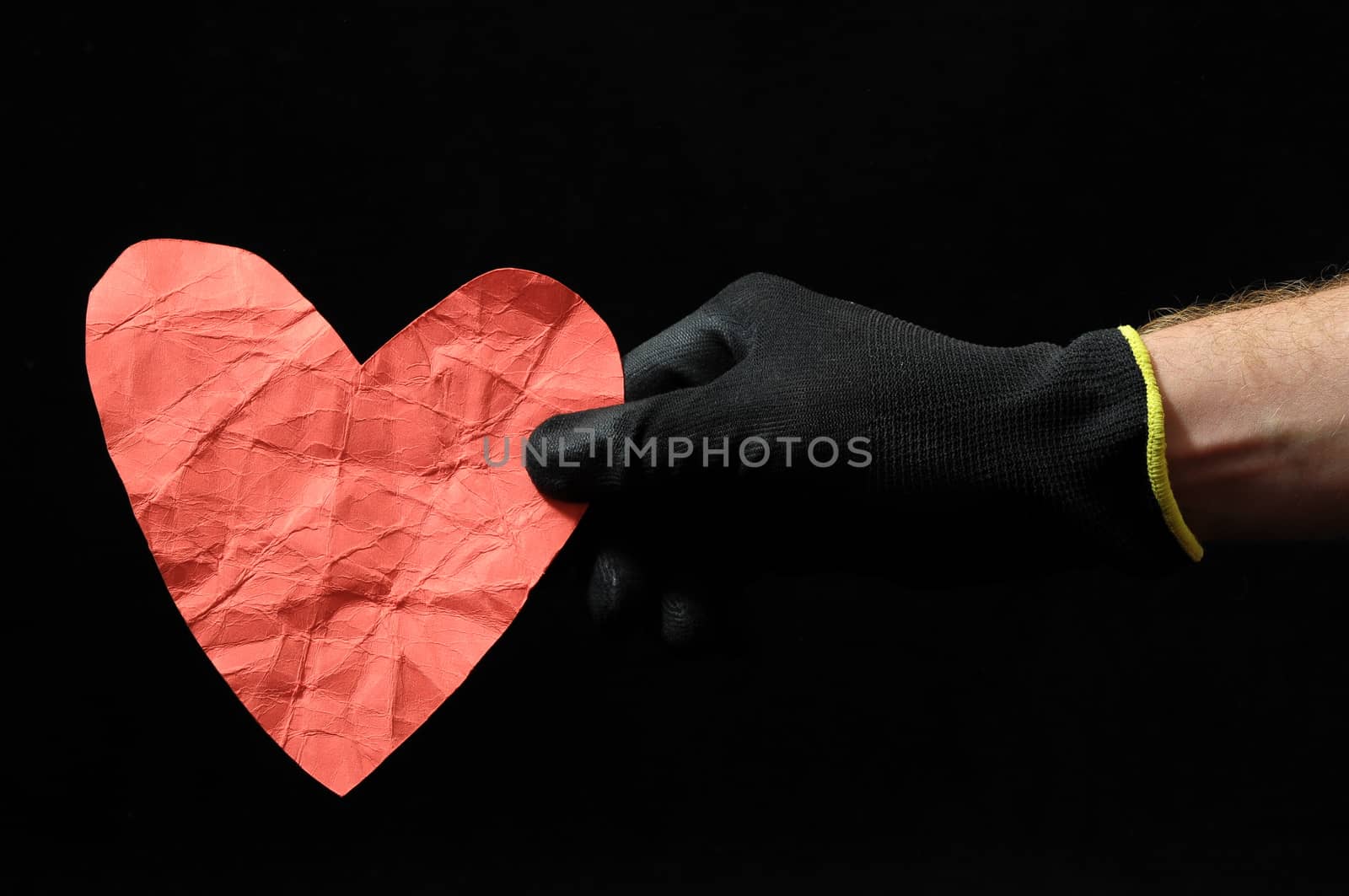 Heart And an Hand on a Black Background