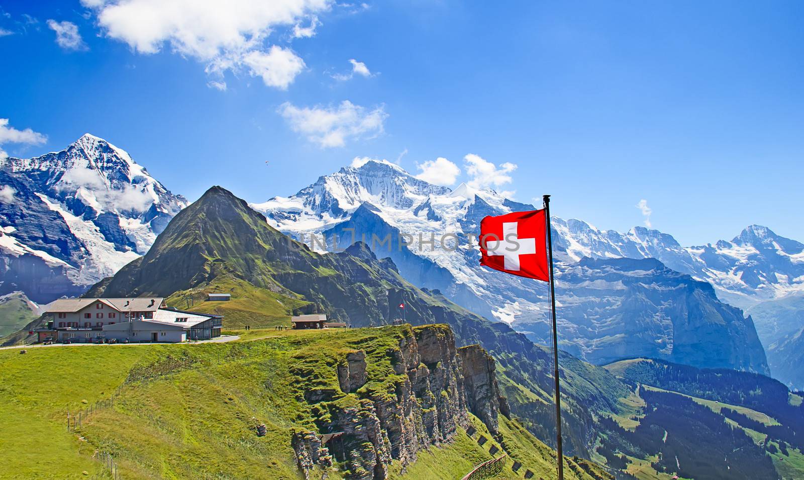 Swiss flag on the top of Mannlichen (Jungfrau region, Bern, Switzerland)