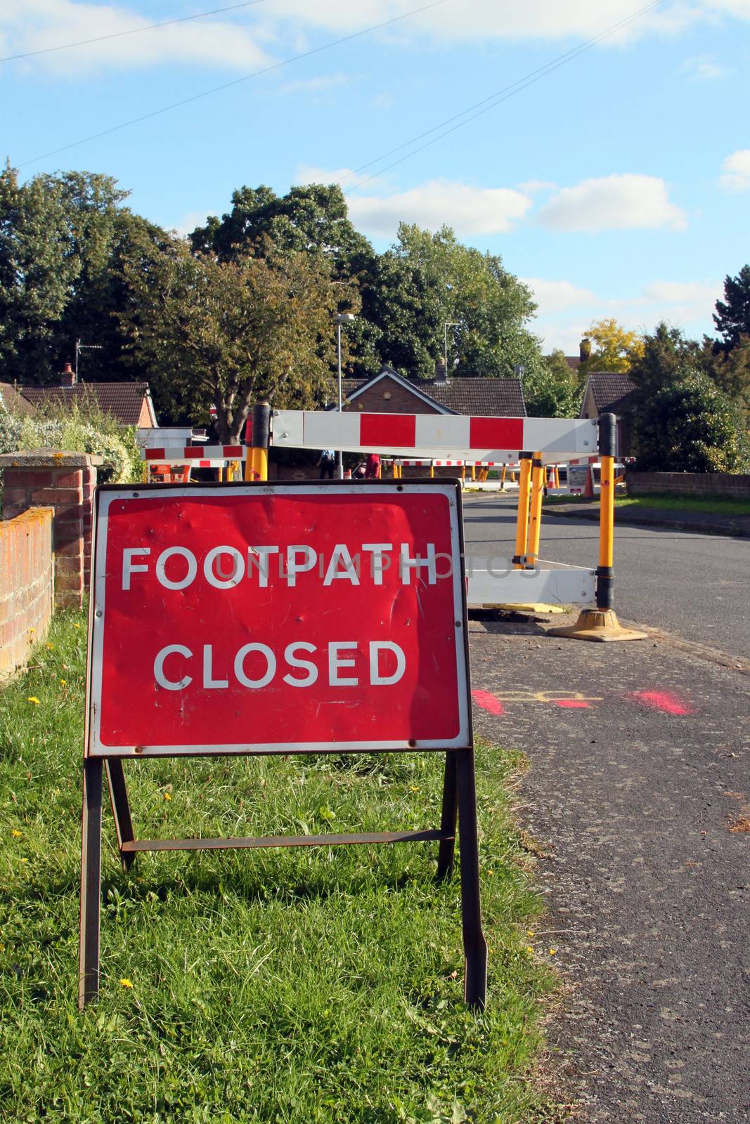 Road work warning signs and barriers in a street in England. 