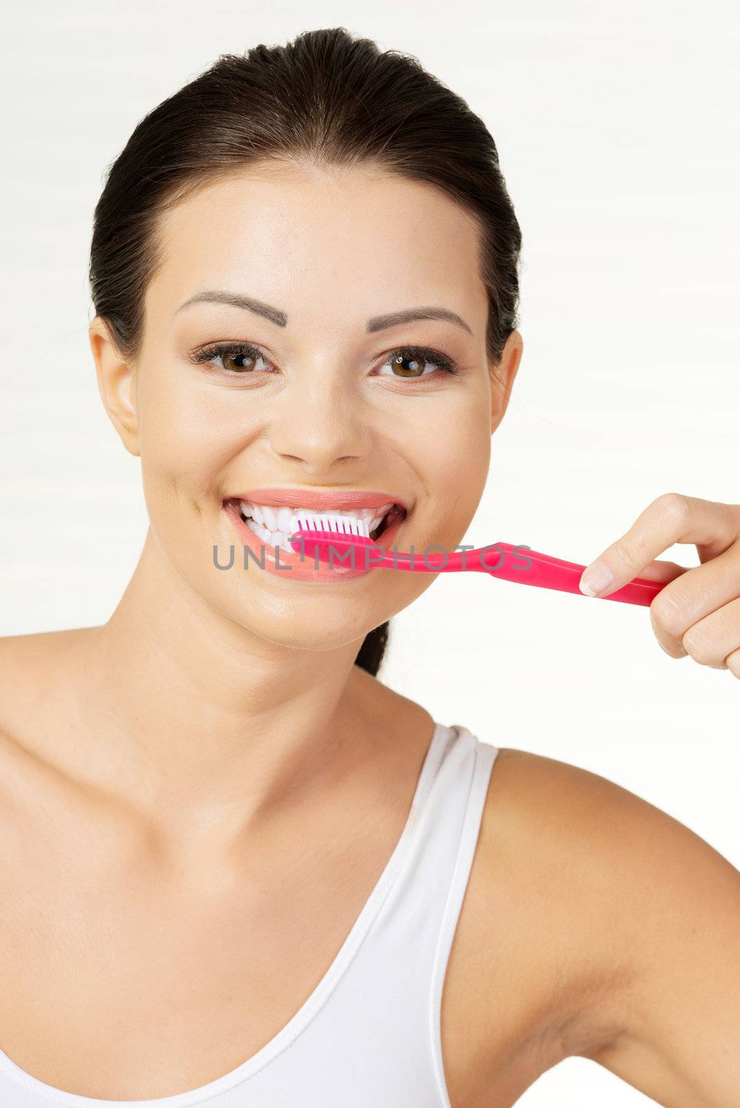 Woman holding tooth brush, isolated by BDS
