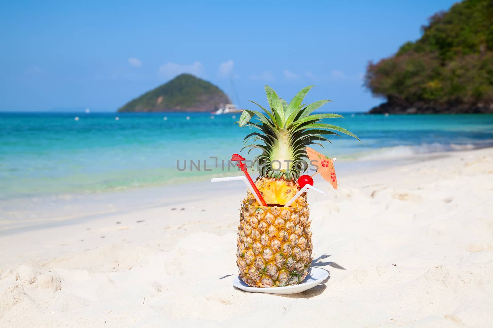 Fresh fruit cocktail on a tropical island beach