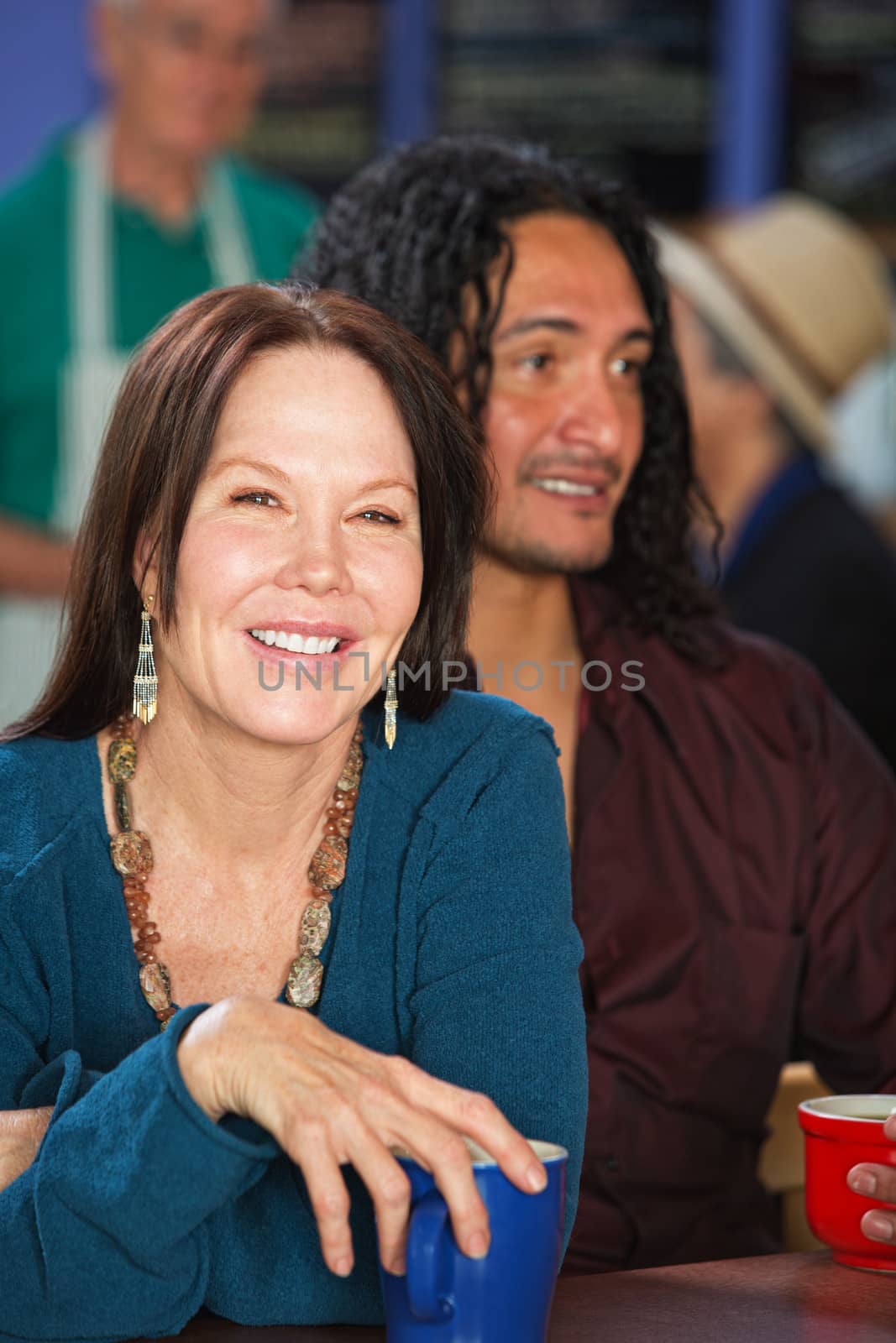 Smiling European woman with Latino man in cafe