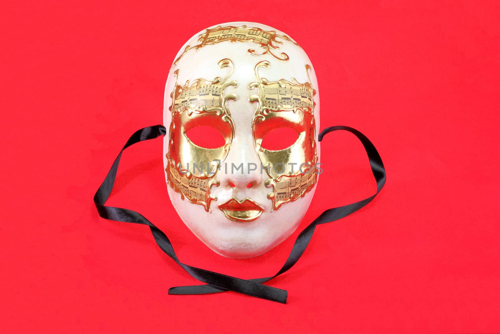 The Venetian mask on a red background