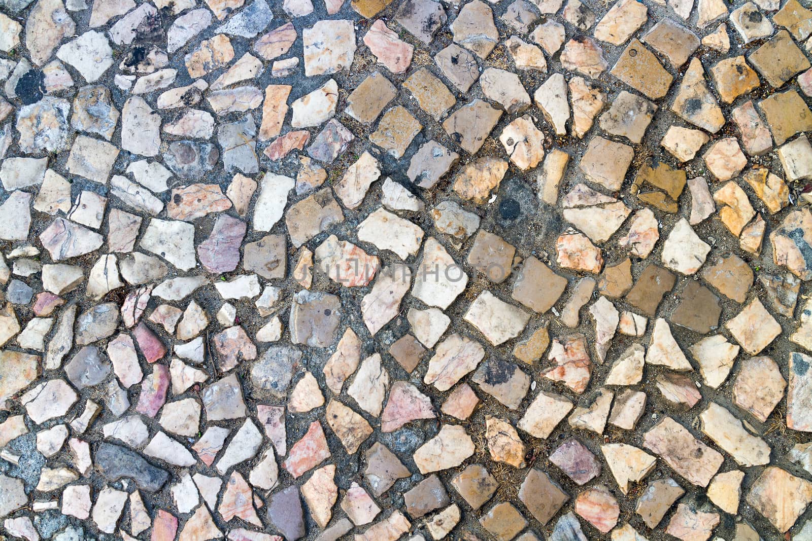 The cobblestone road is made of pebbles by Discovod