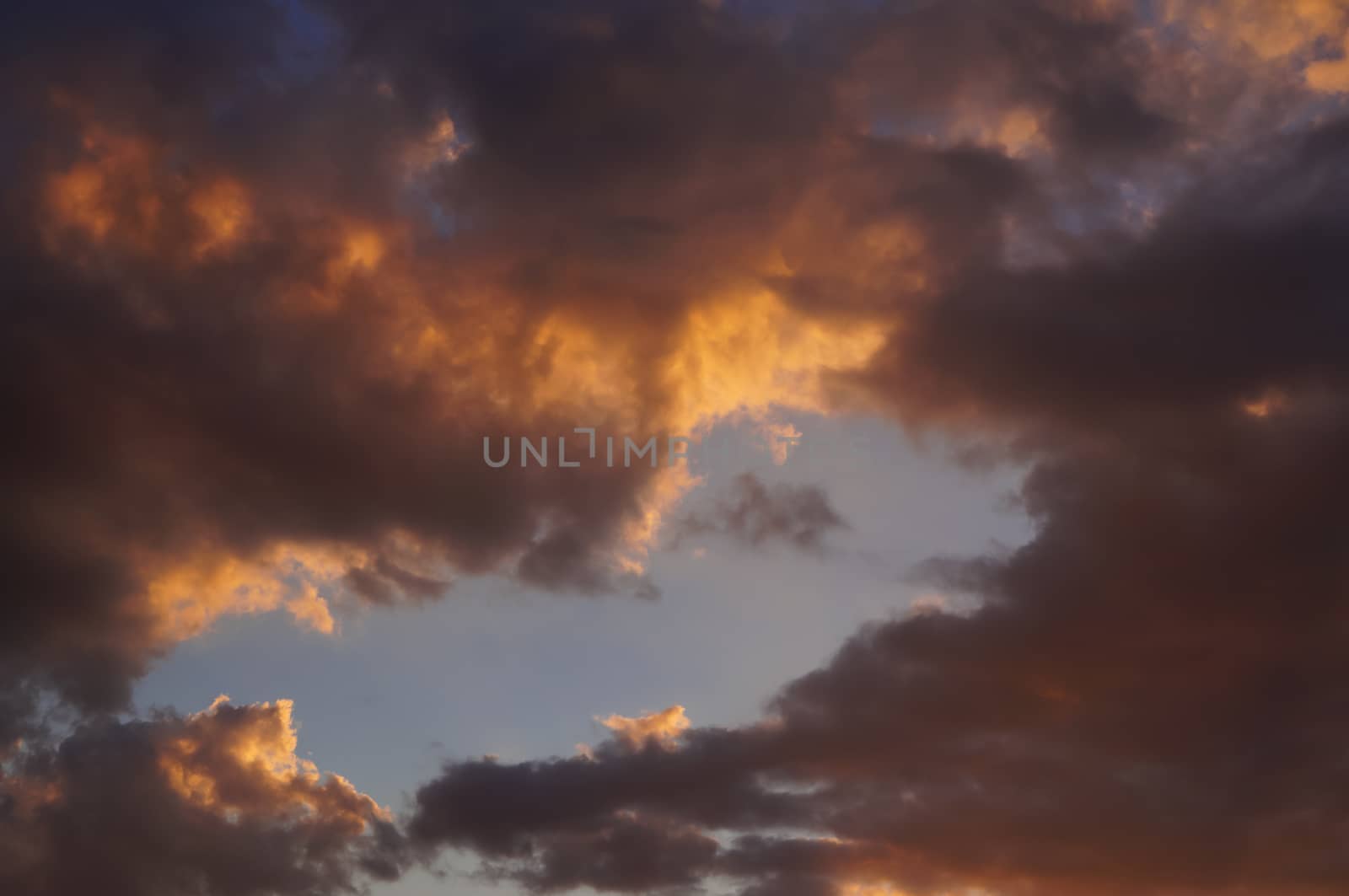 Clouds in the rays of the setting sun