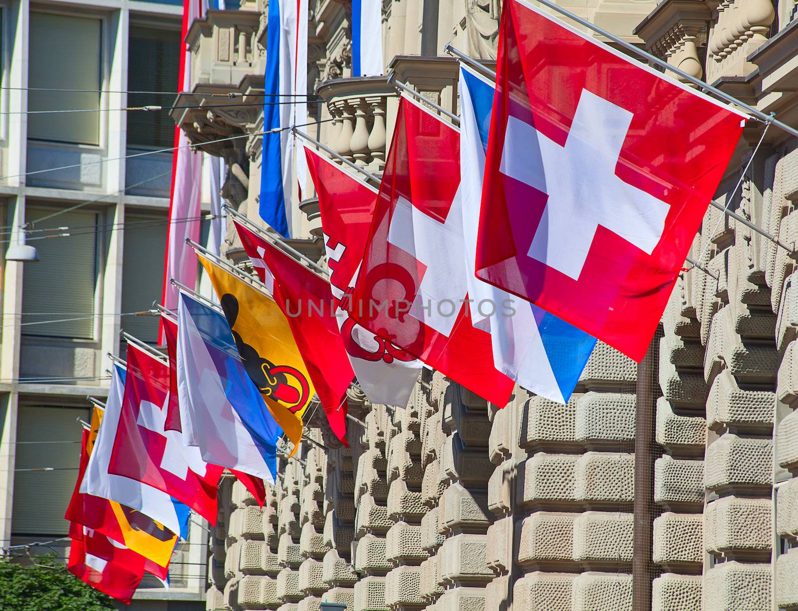 Ancient Paradenplatz square in Zurich decorated with swiss flags