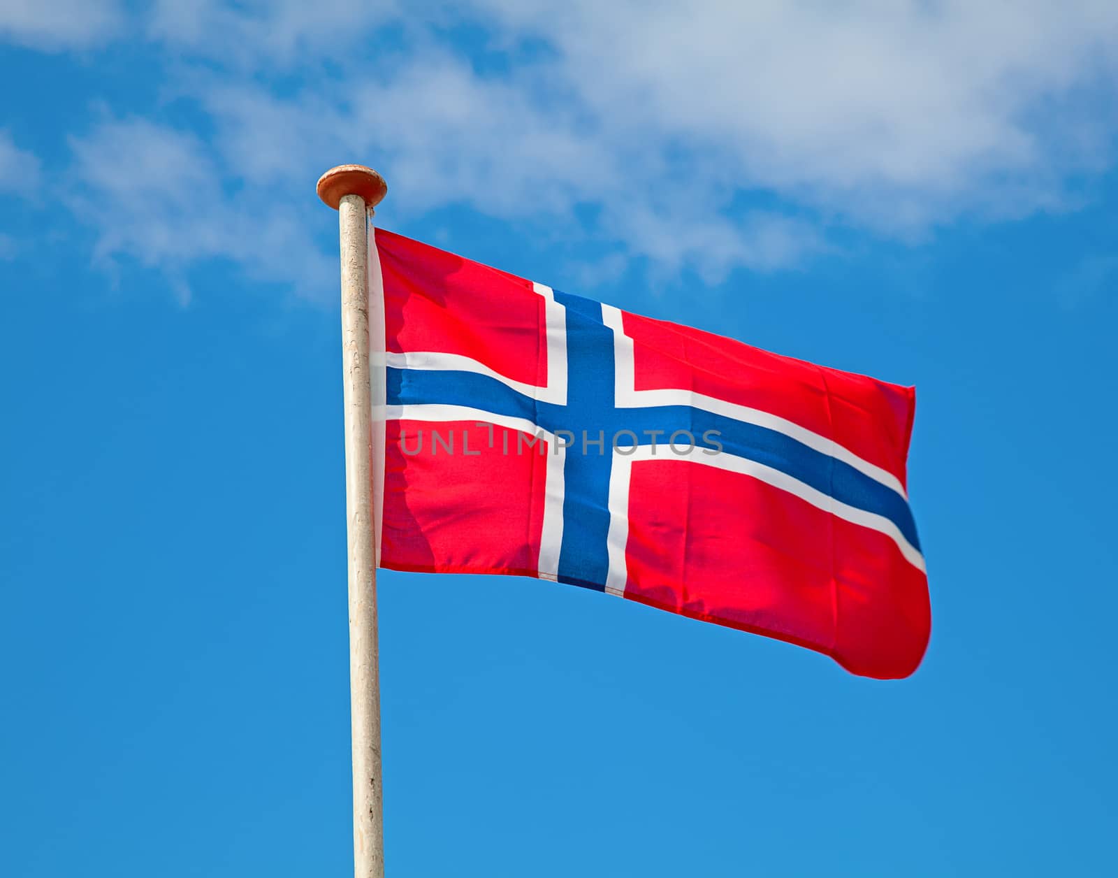 Flag of Norway in the blue sky