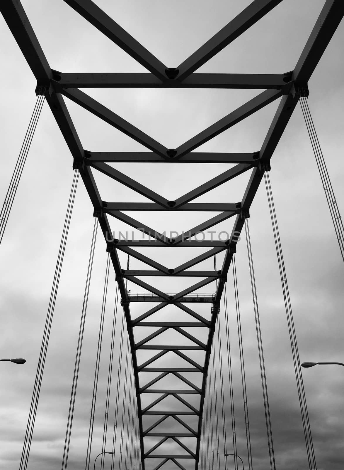 Portland's Fremont Bridge black and white image against a cloudy sky