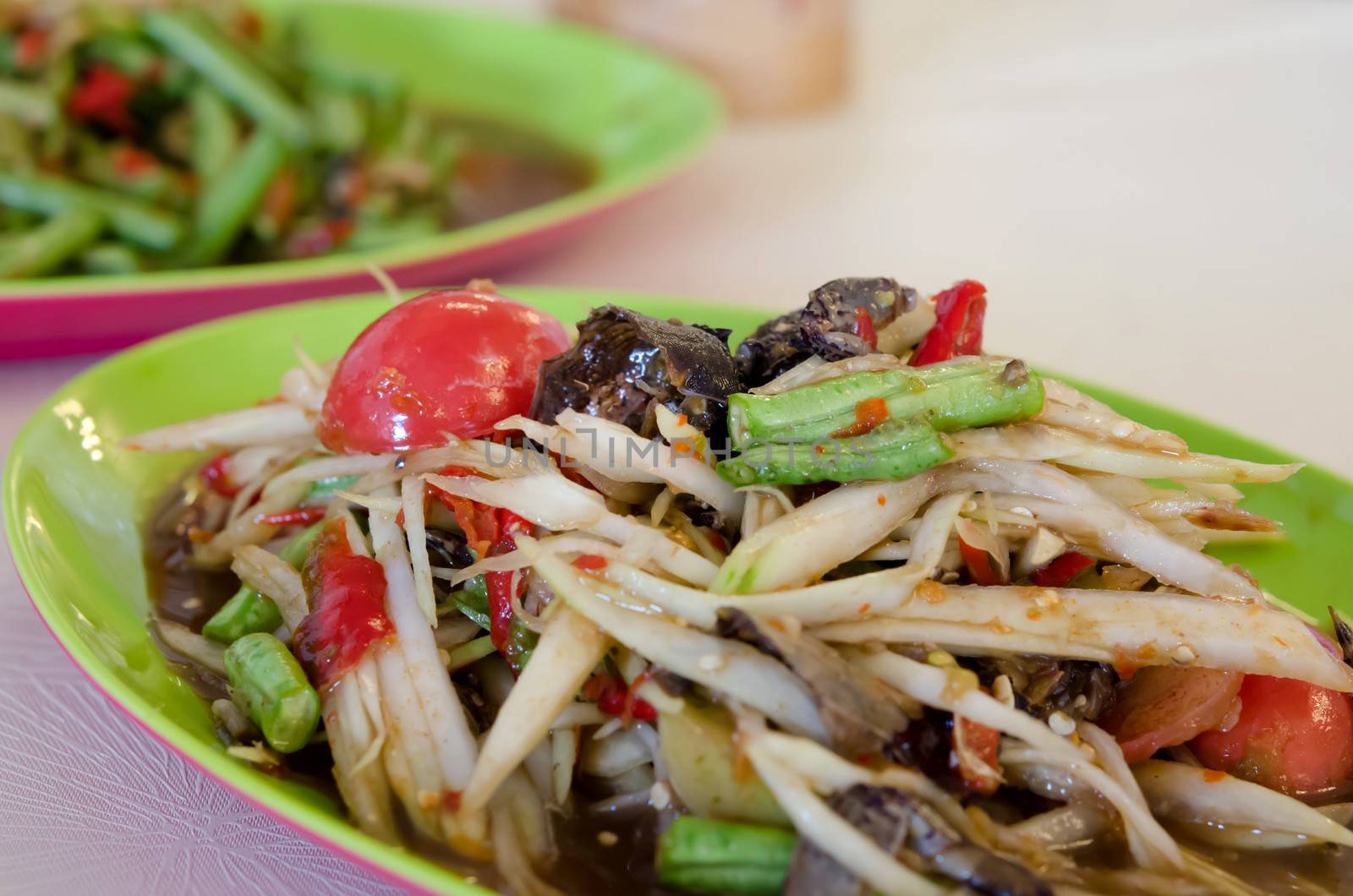 close up spicy papaya salad with crab and vegetable , very spicy
