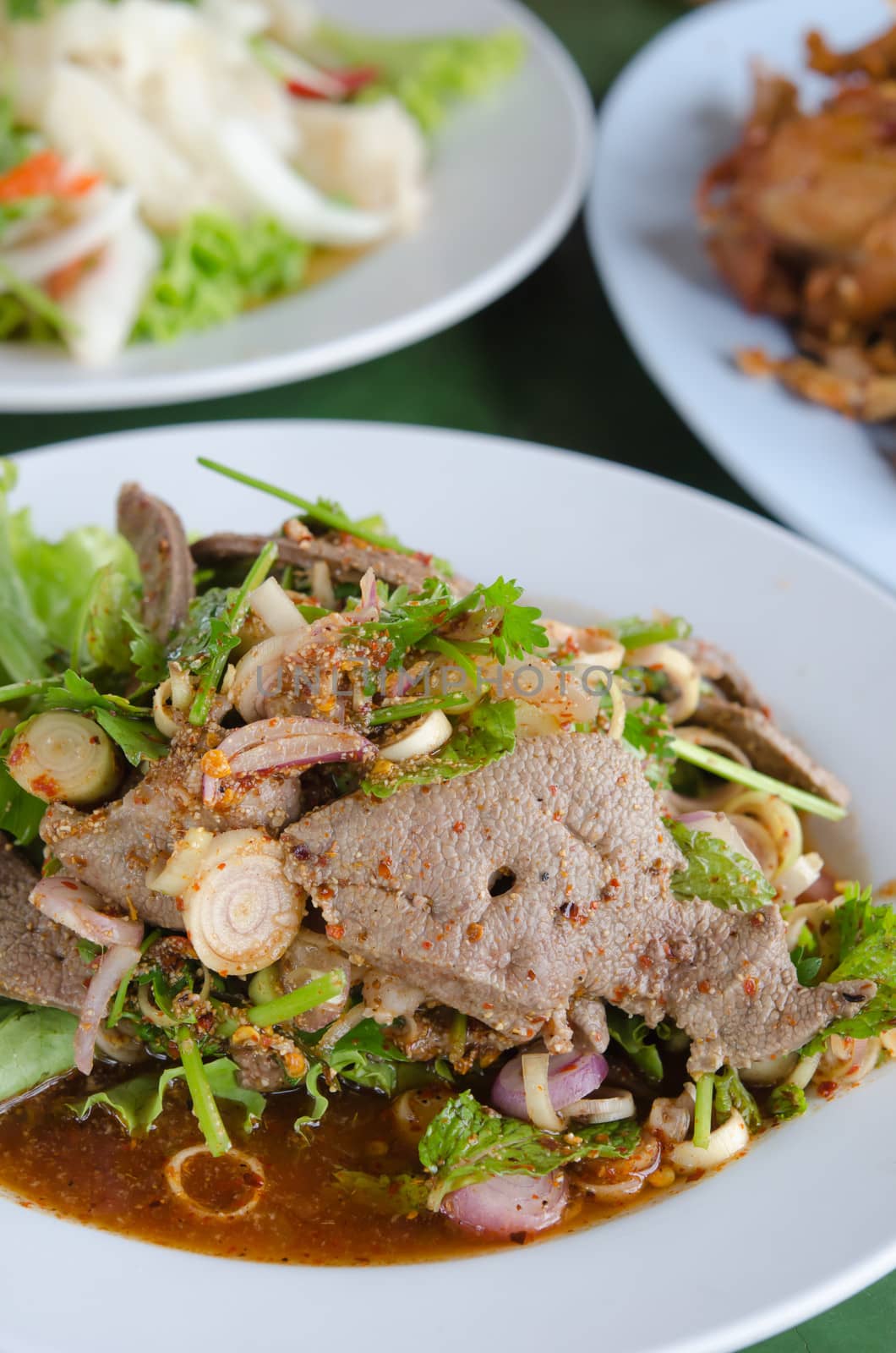 spicy sliced liver salad on dish , is a Thai spicy  food 