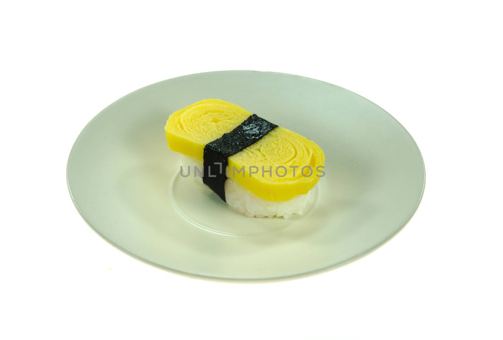 Tamago yaki is sushi using an egg, like a sushi omelette on dish