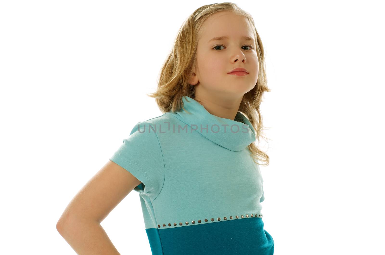 Blonde Girl in Blue Dress Posing at Camera on white background