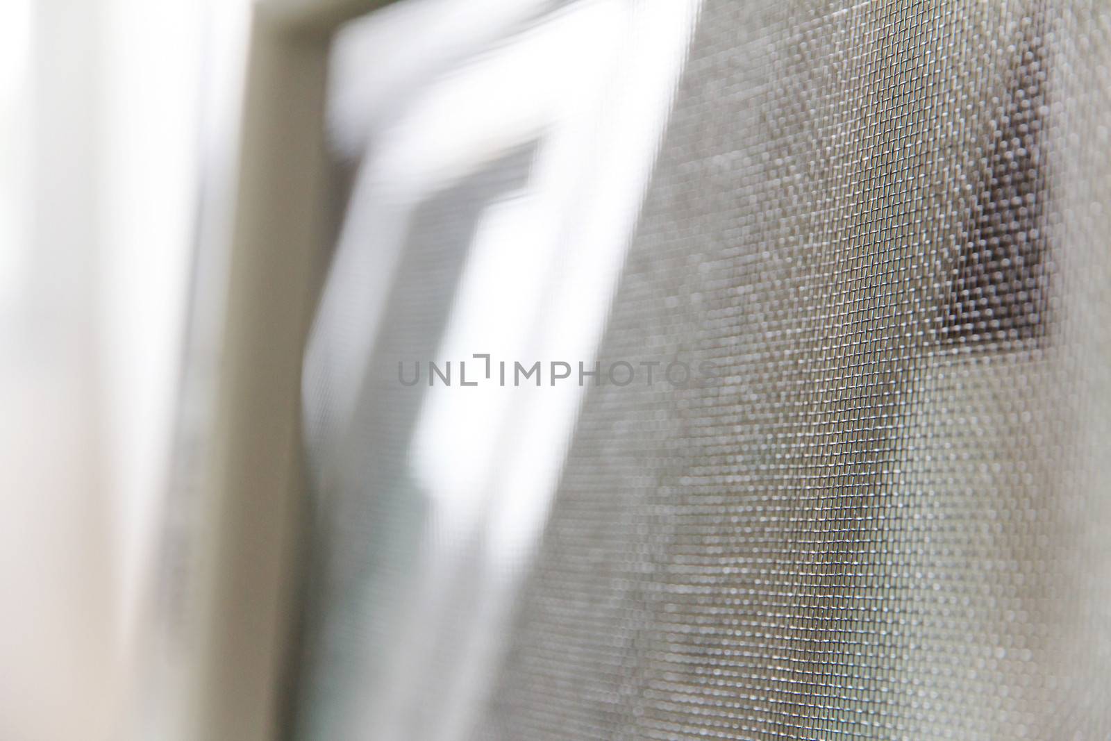 close up of mosquito net and window background