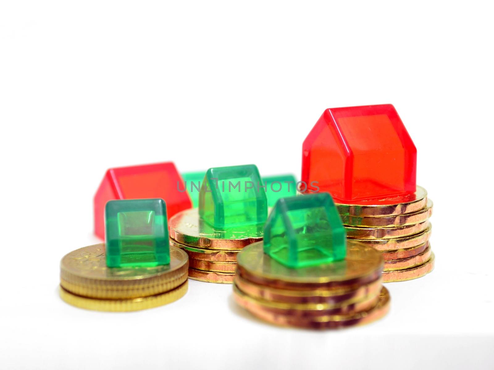 Houses and Coins Property Investment Concept