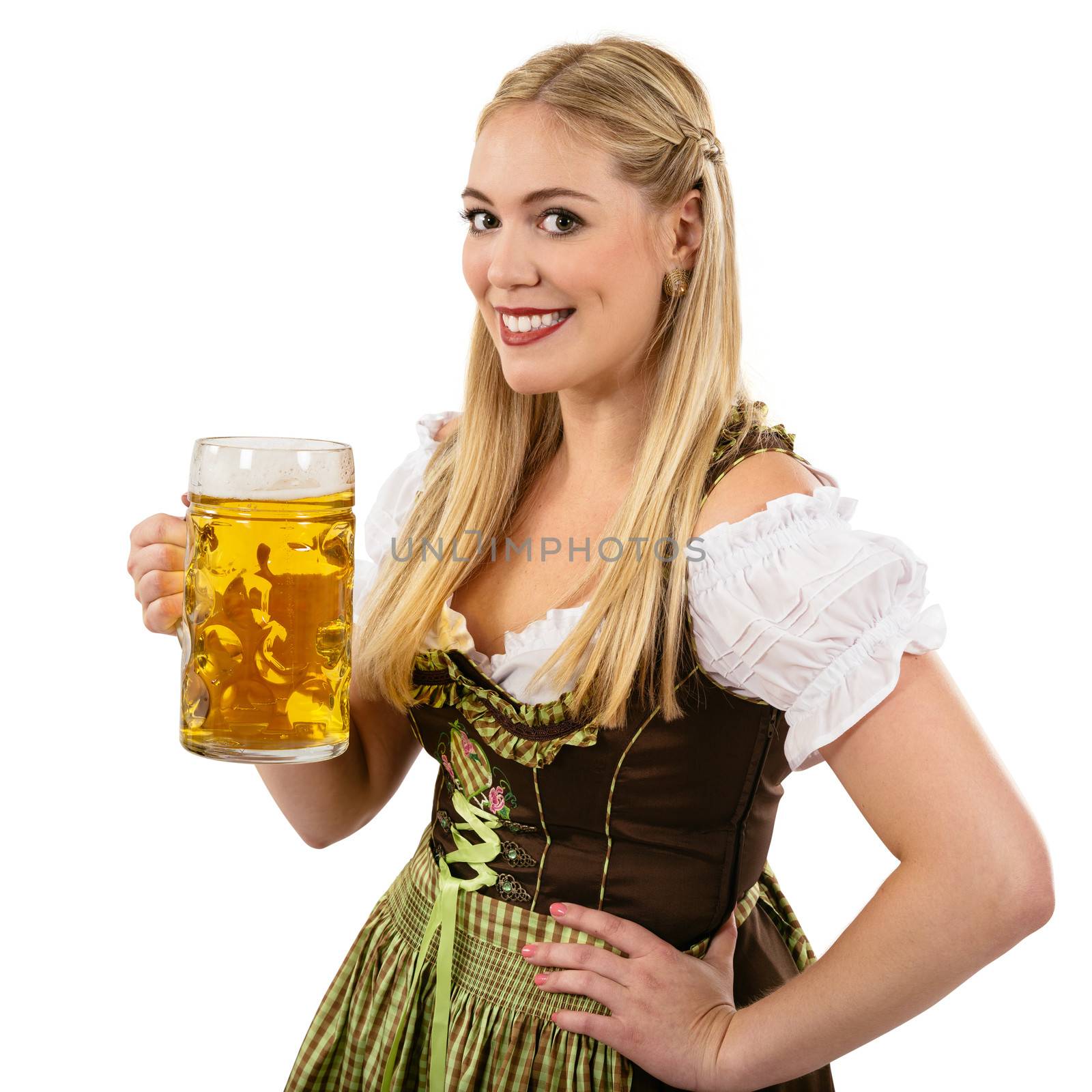 Photo of a beautiful female waitress wearing traditional dirndl and holding a huge beer over white background.