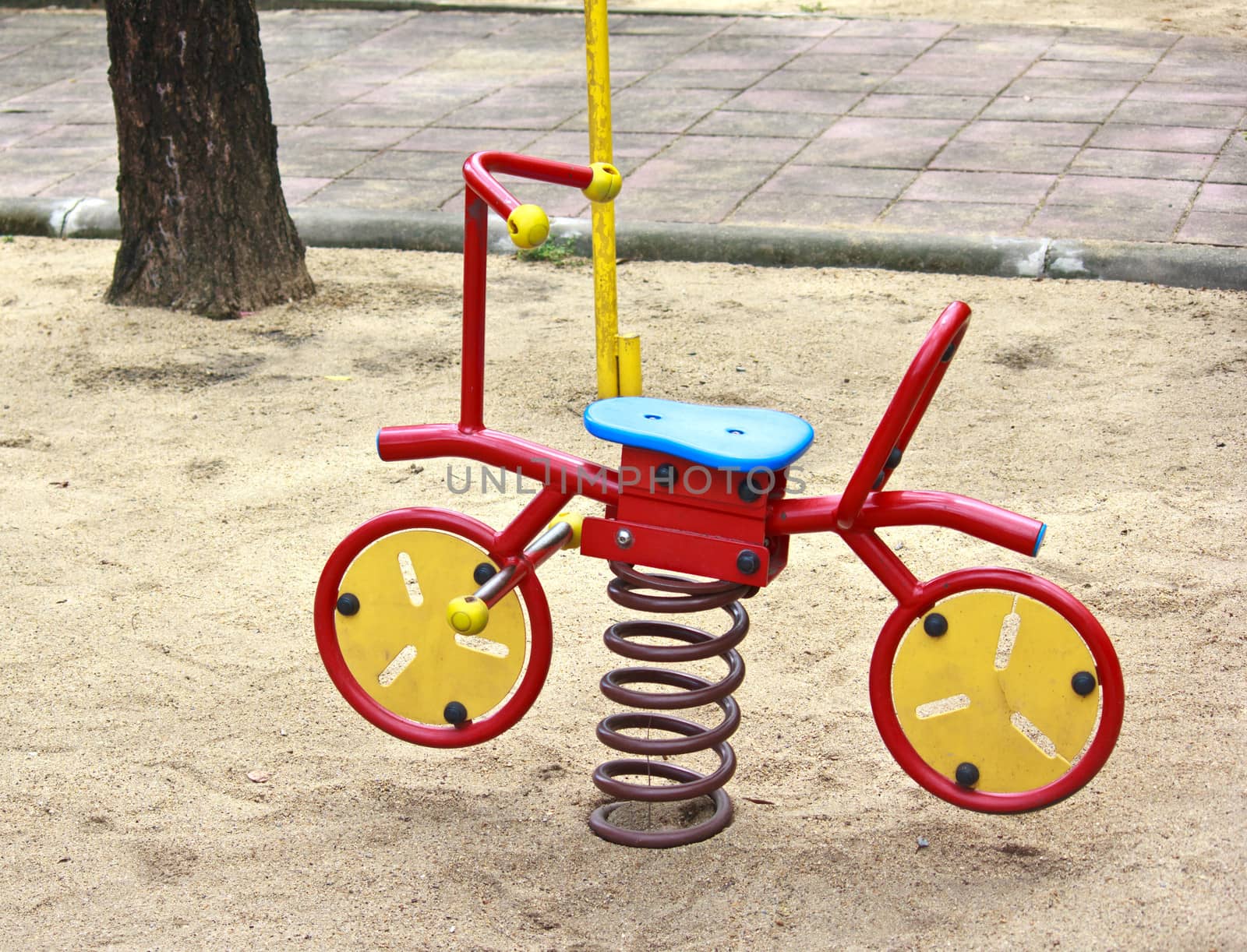toy bicycle at a playground in Thailand
