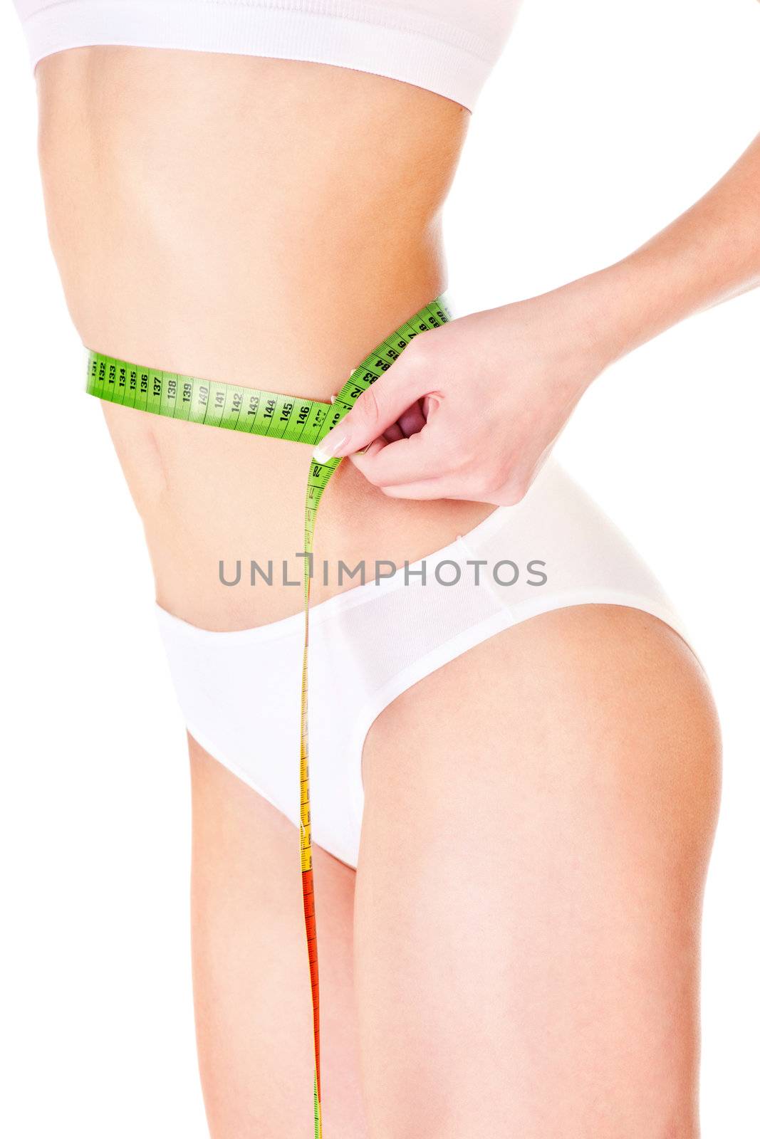Measure tape around slim woman's waist, isolated on white. Health concept 