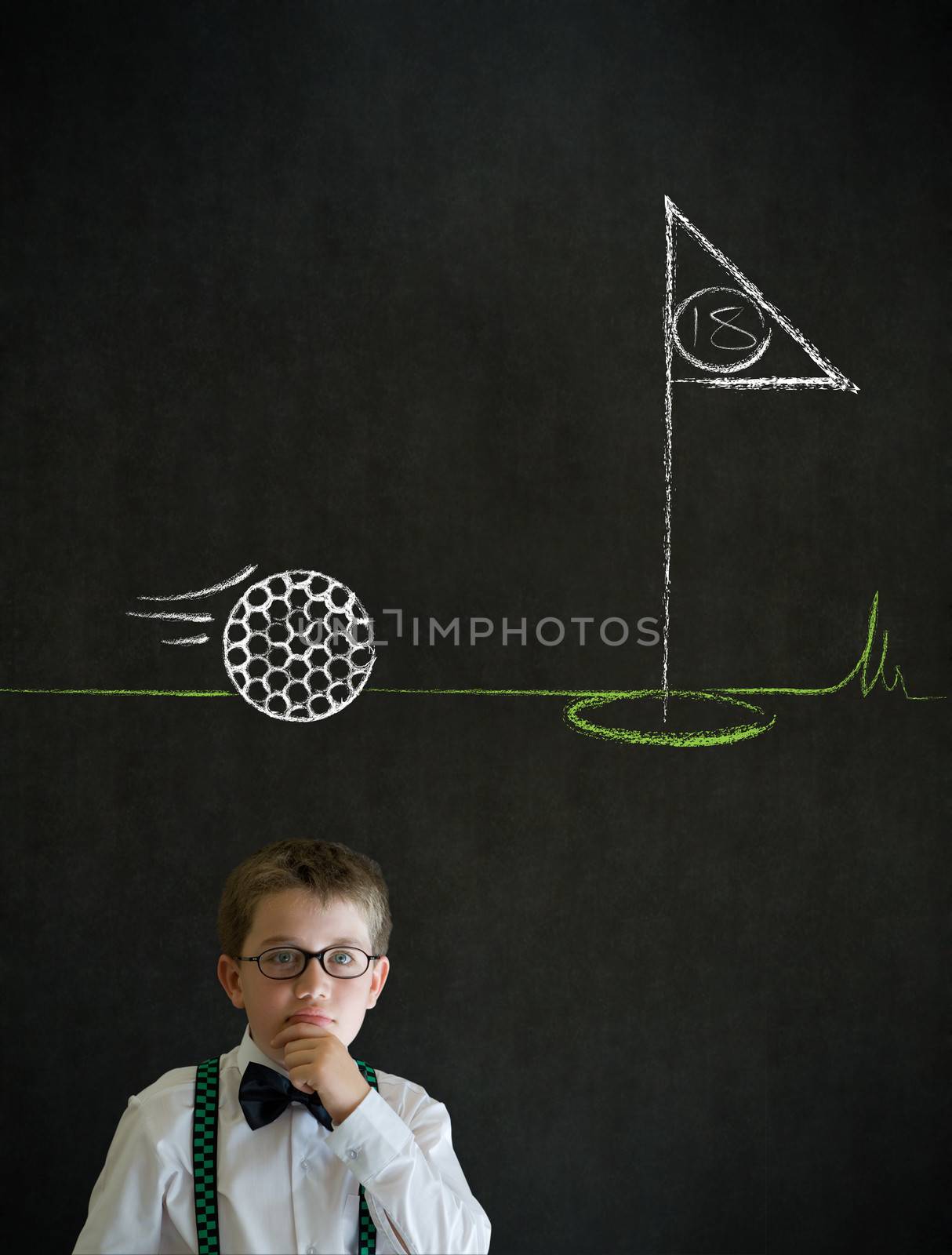 Thinking boy dressed up as business man with chalk golf ball flag green on blackboard background
