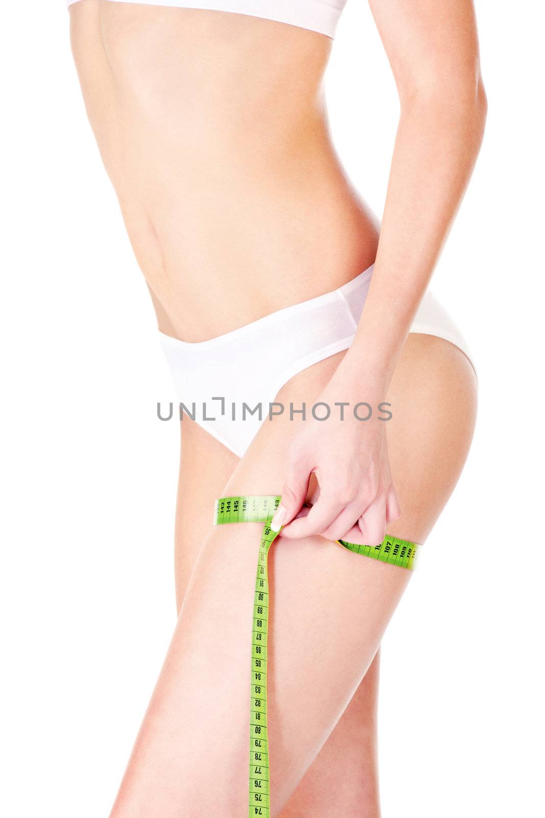 Measure tape around slim woman's leg, isolated on white. Health concept