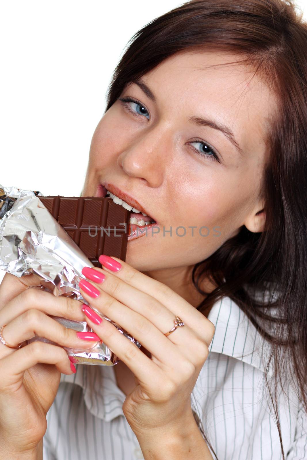 Girl eating a chocolate candy