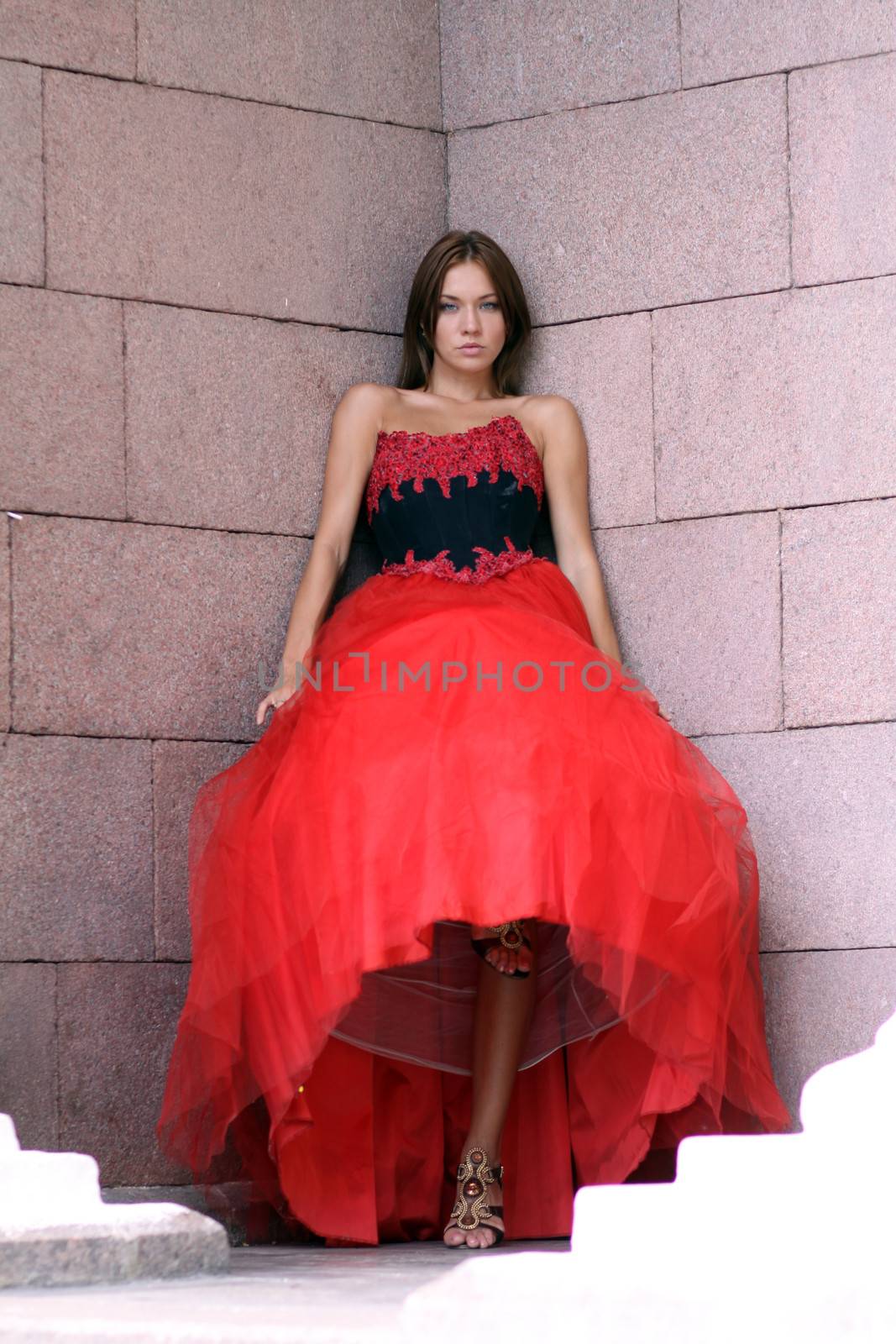 Attractive sexy woman in a red dress