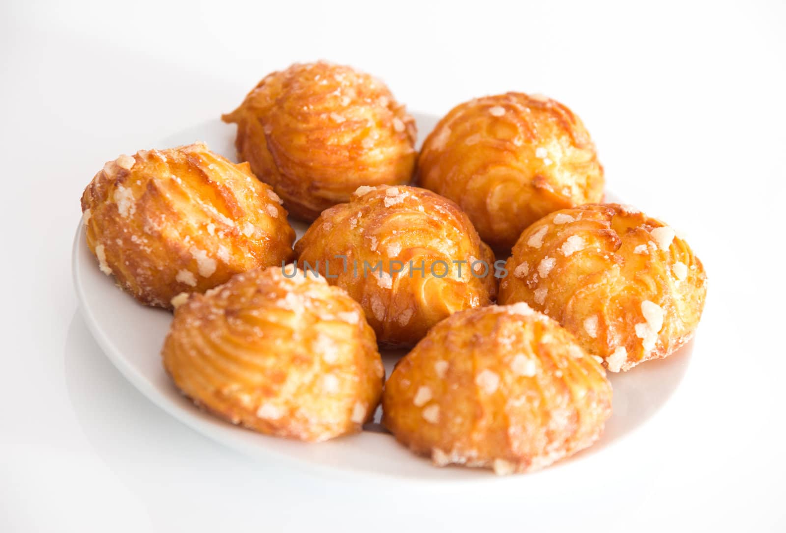 Fresh tasty cookies on a white plate.