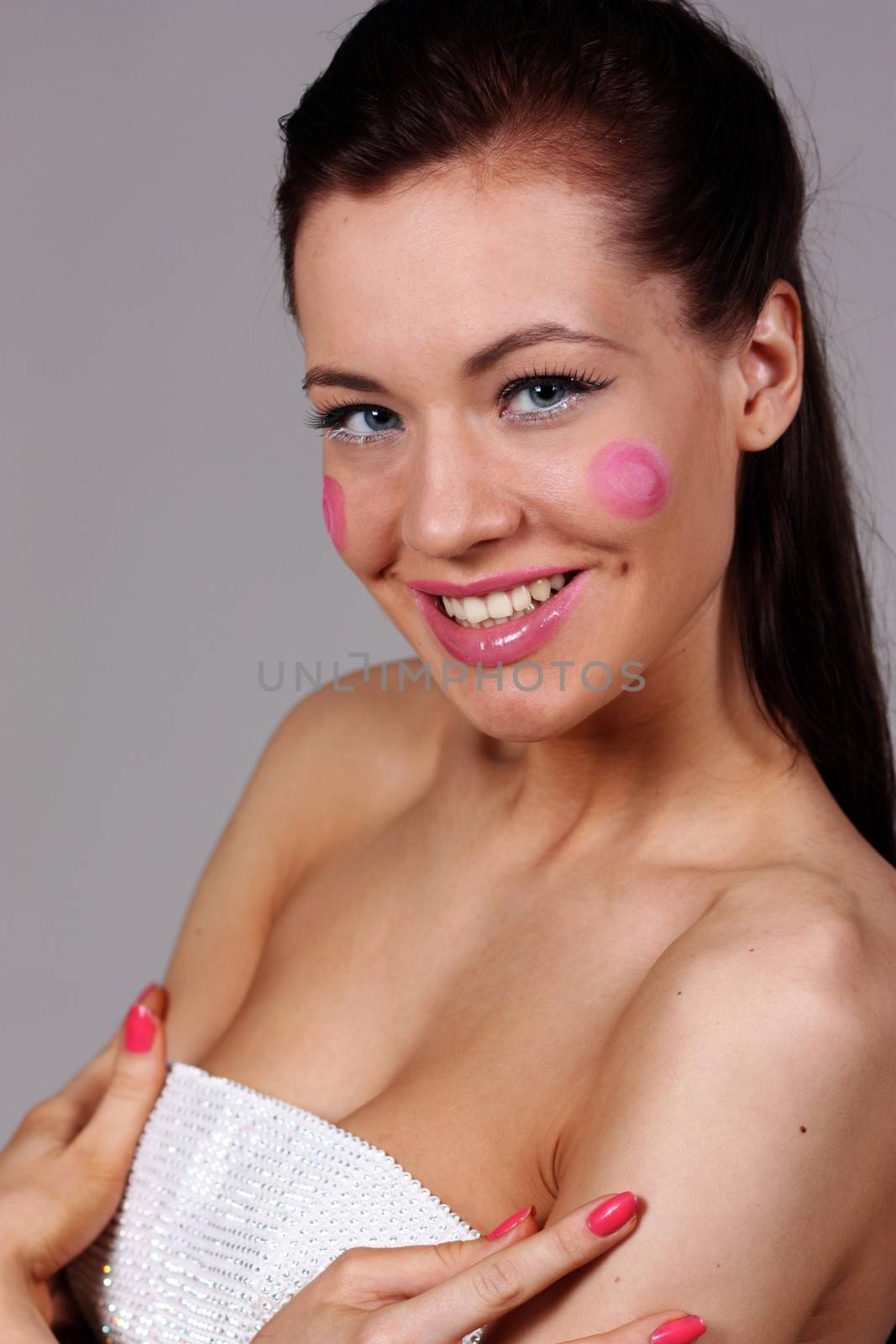 Beautiful young woman in gray background