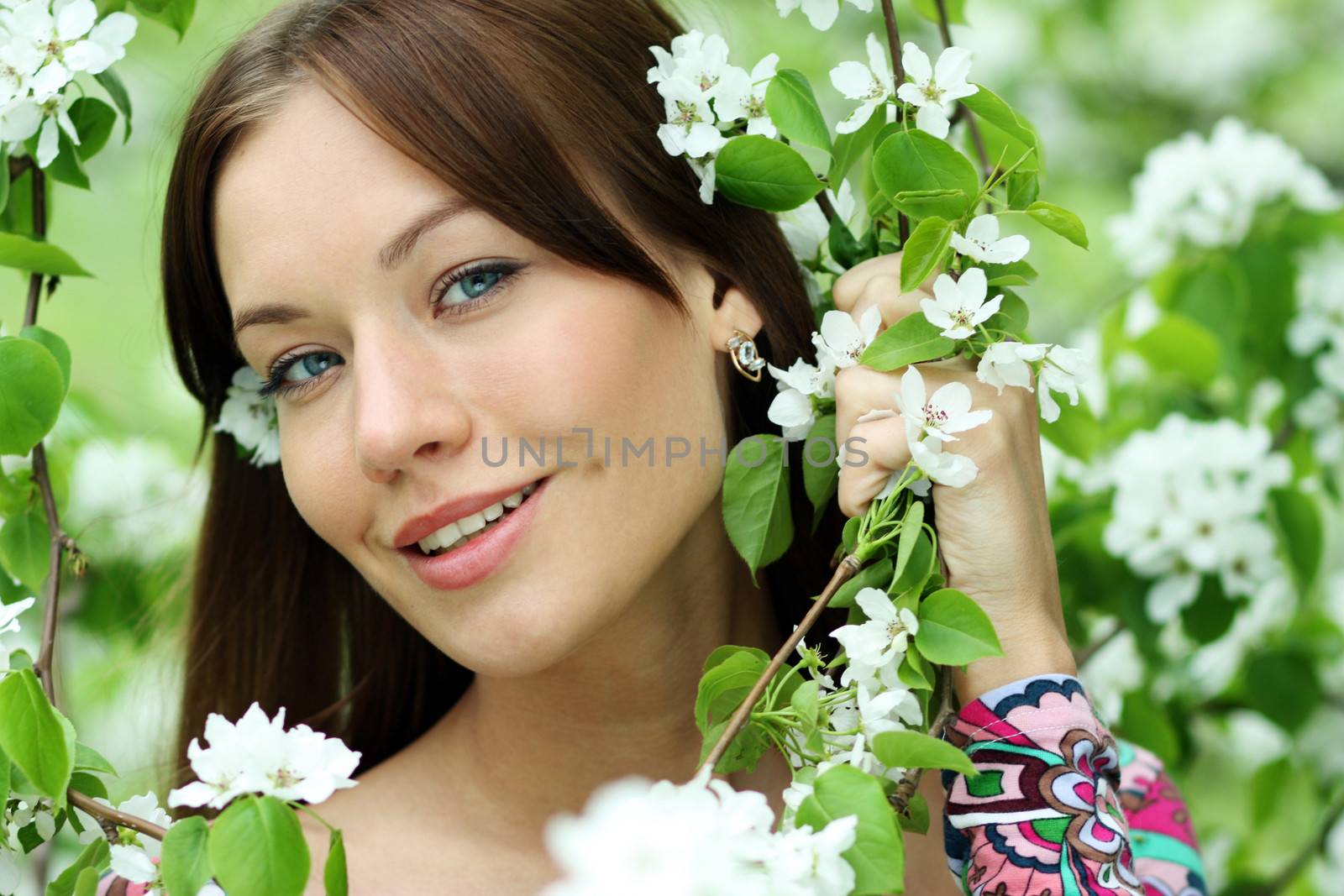 Portrait of beautiful woman in spring blossom