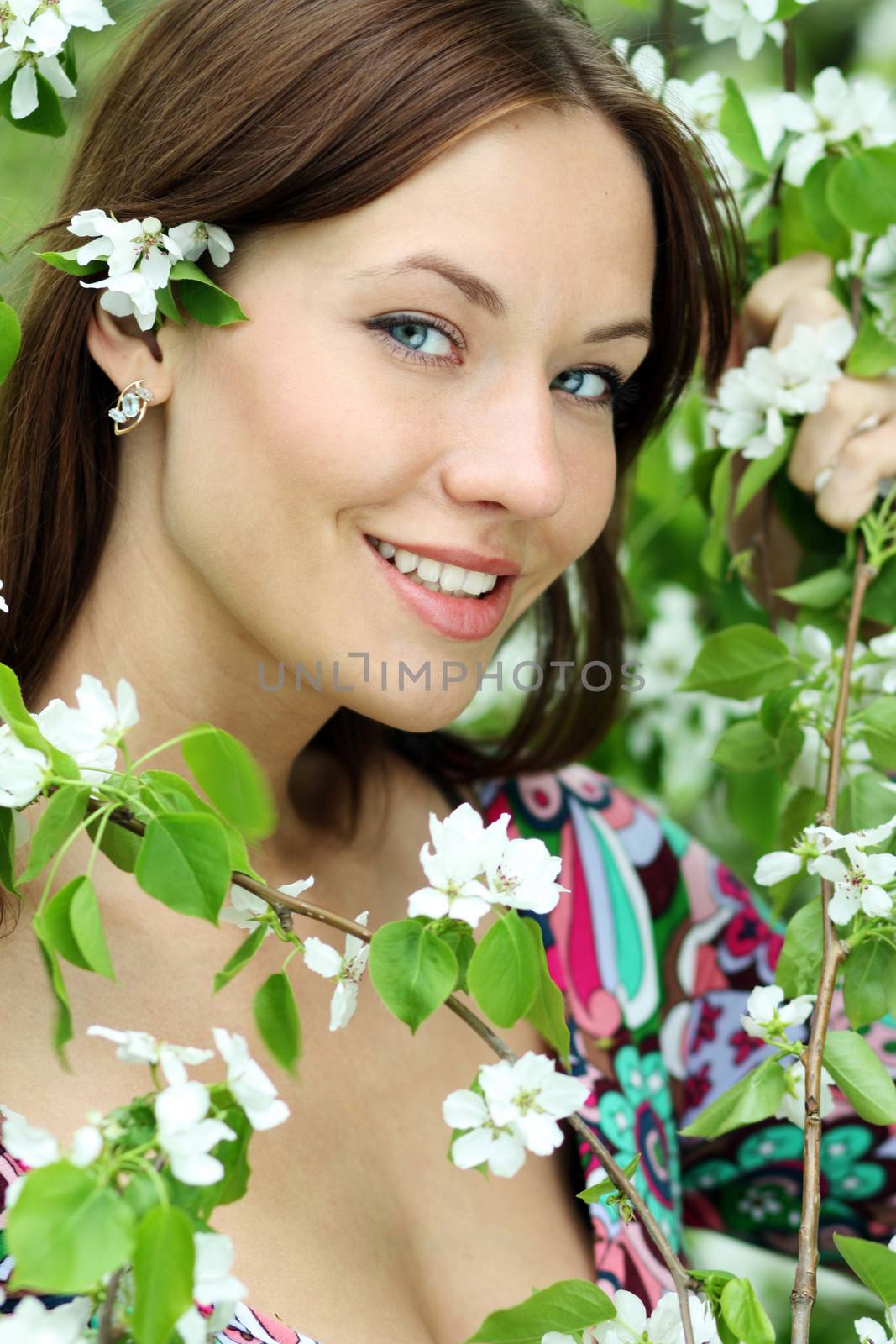 Portrait of beautiful woman in spring blossom